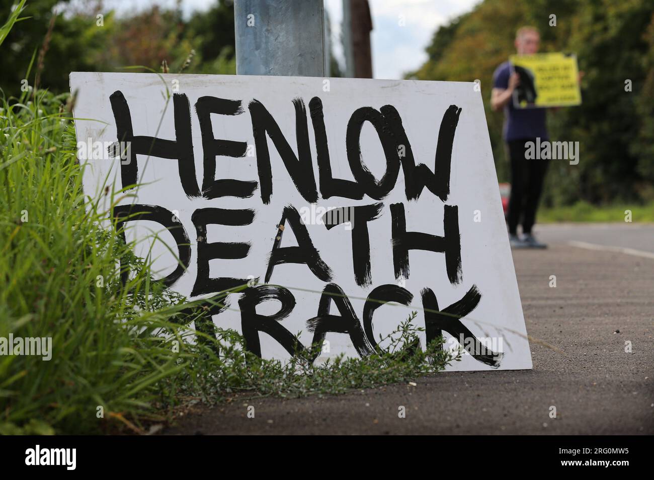 Henlow, UK. 06th Aug, 2023. Protesters lay a sign outside the dog stadium that says 'Henlow Death Track' while others encourage support from passing motorists by holding up roadside signs during the demonstration. Animal Rights activists protest outside Henlow dog racing track. They are aiming to highlight the cruelty associated with dog racing. In 2021 there were 4422 injuries and 120 deaths on registered greyhound race tracks in the UK. (Photo by Martin Pope/SOPA Images/Sipa USA) Credit: Sipa USA/Alamy Live News Stock Photo