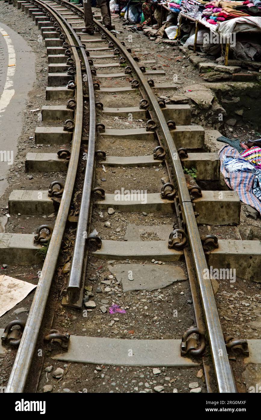 parallel railway tracks of toy train running in Darjeeling Stock Photo