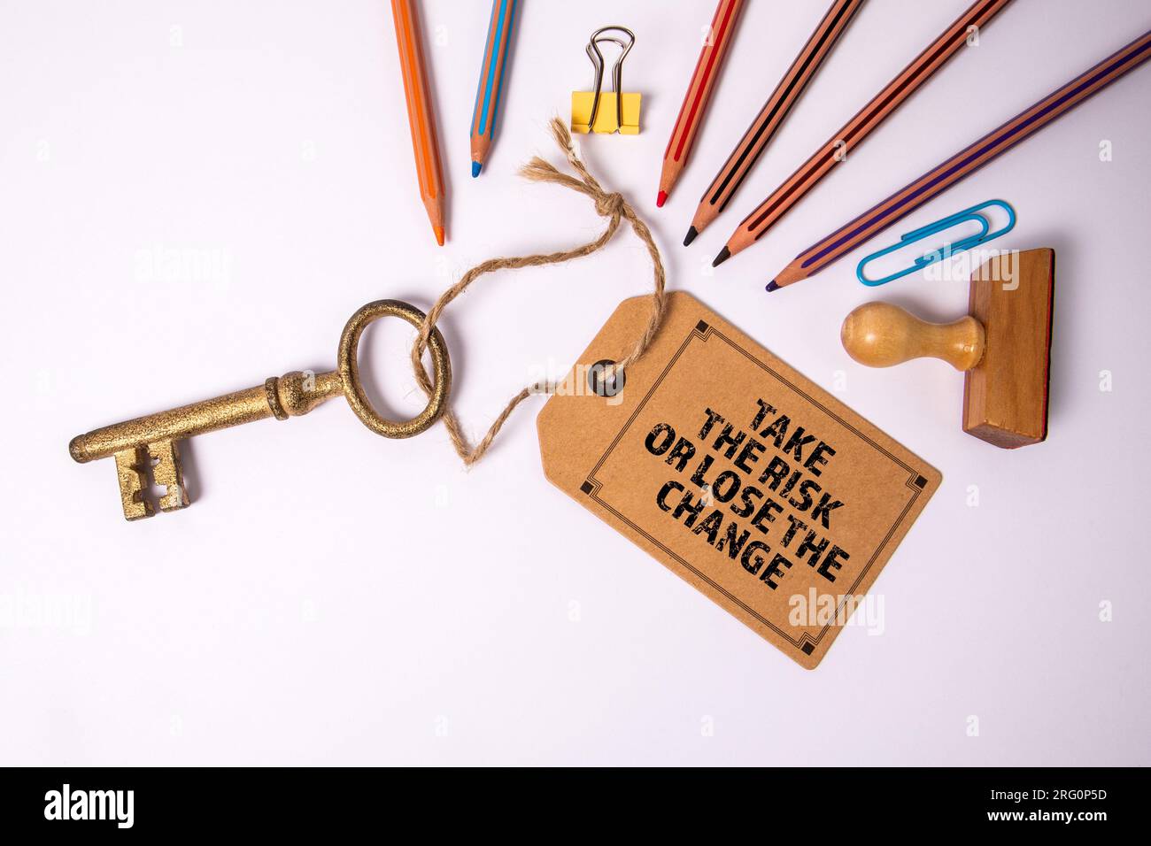 TAKE THE RISK OR LOSE THE CHANGE. Cardboard price tag with text and key ...