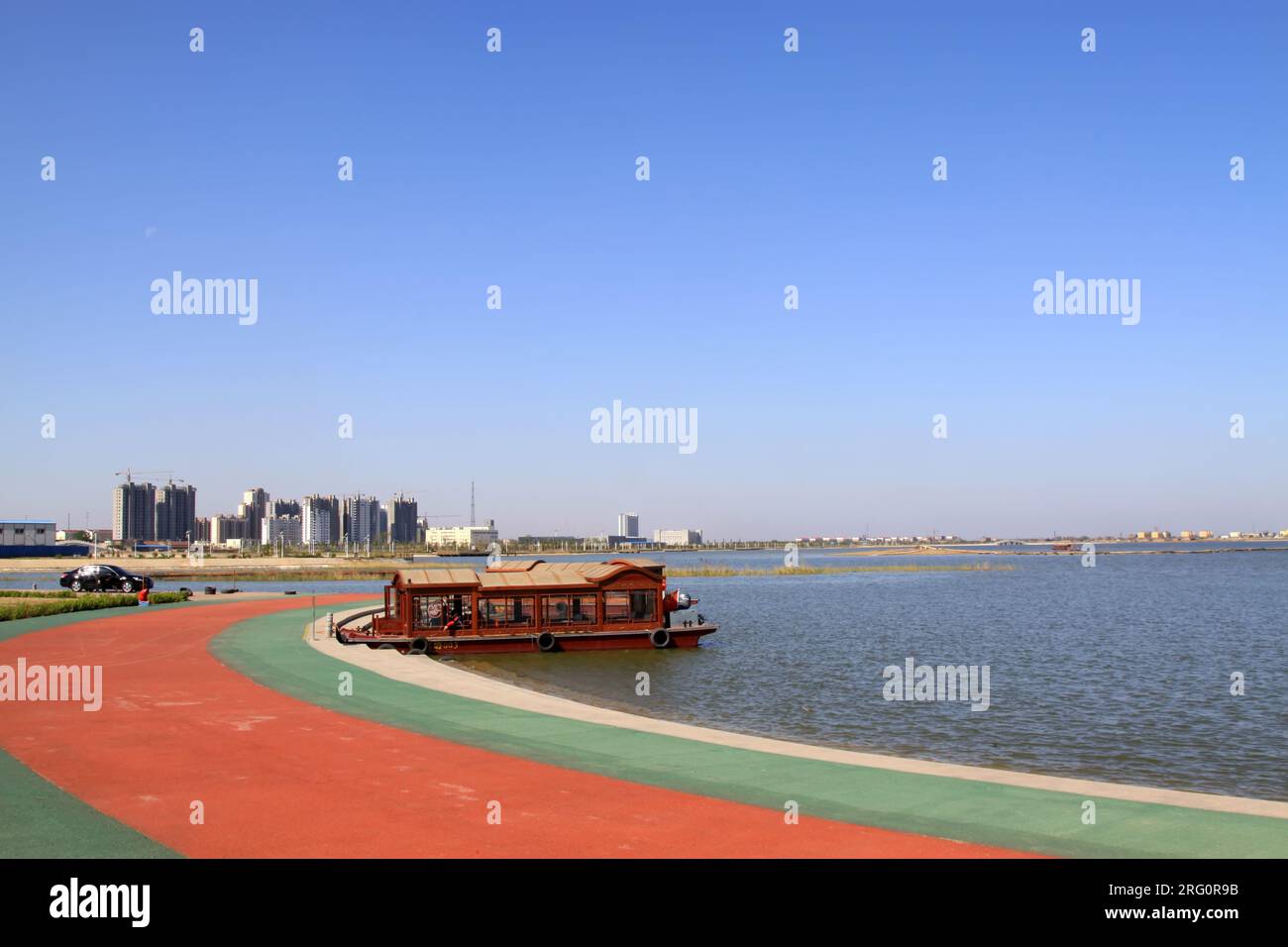 landscape architecture by the lake under the blue sky, Hengshui city ...