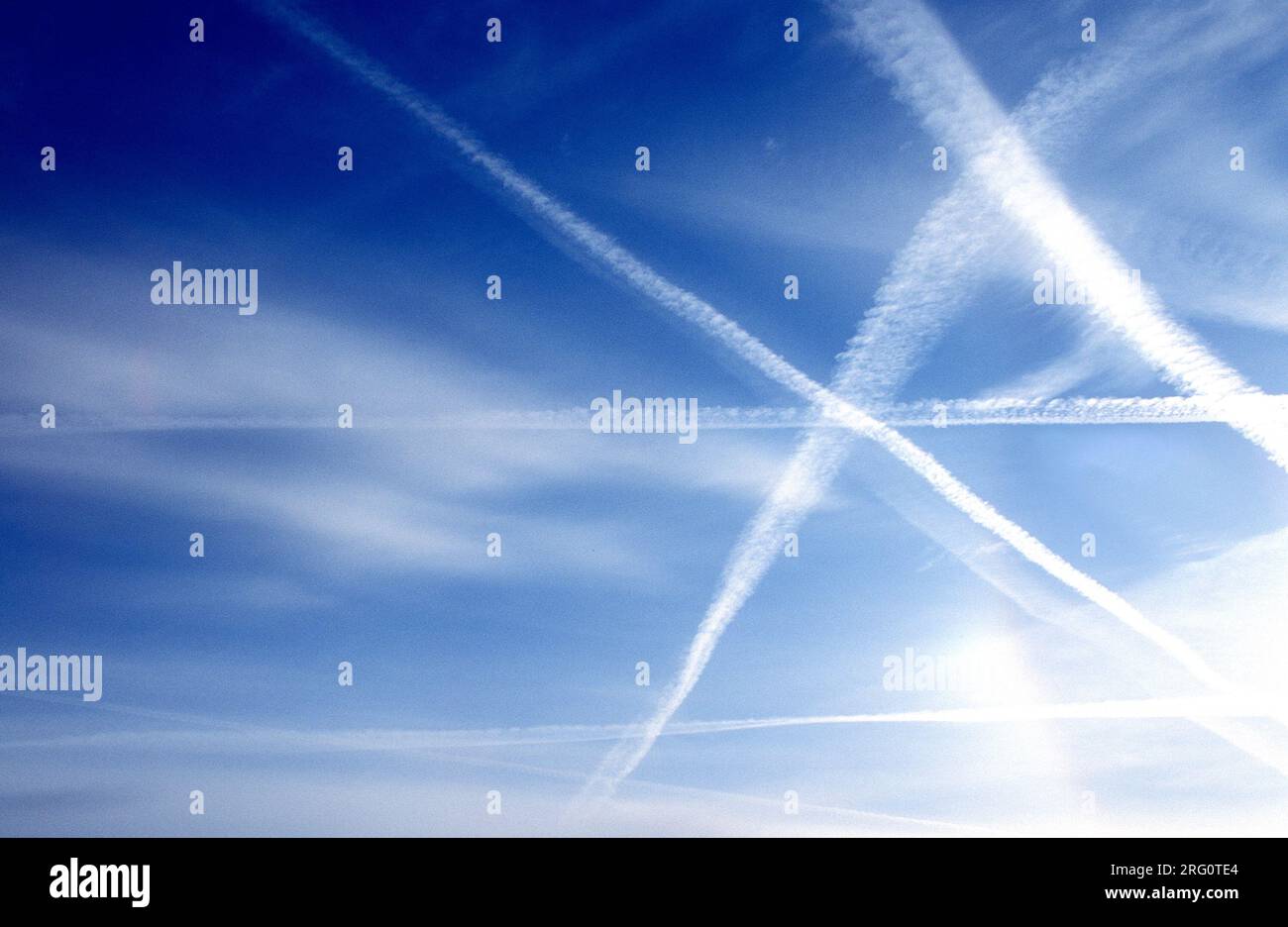 Aircraft vapor trails in Bavarian sky, Germany Stock Photo