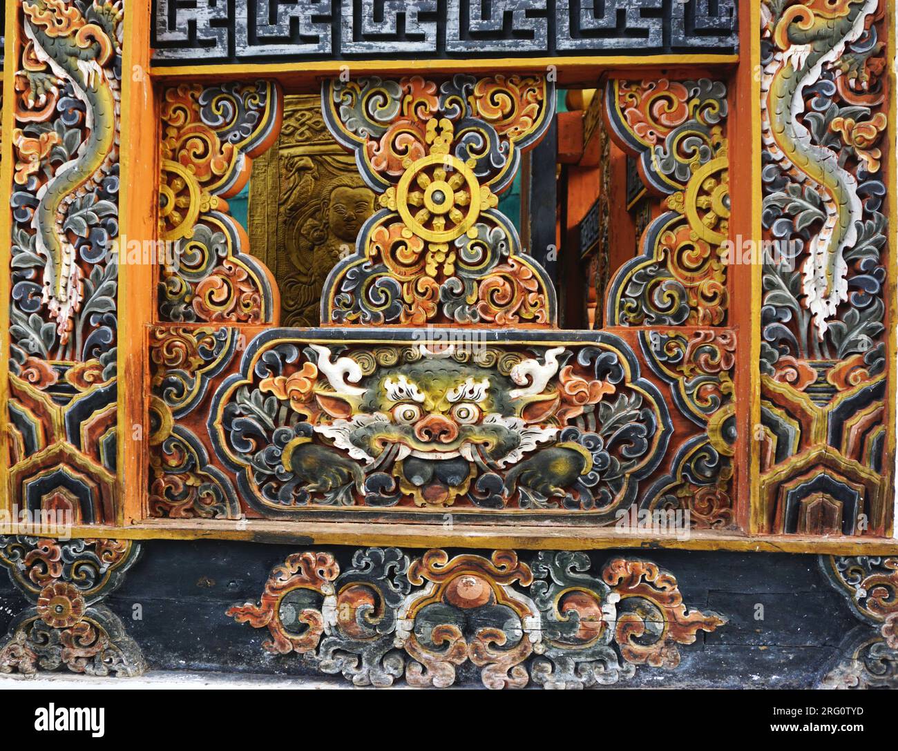 Ancient carved and painted woodwork including the Buddhist 8-spoked ...