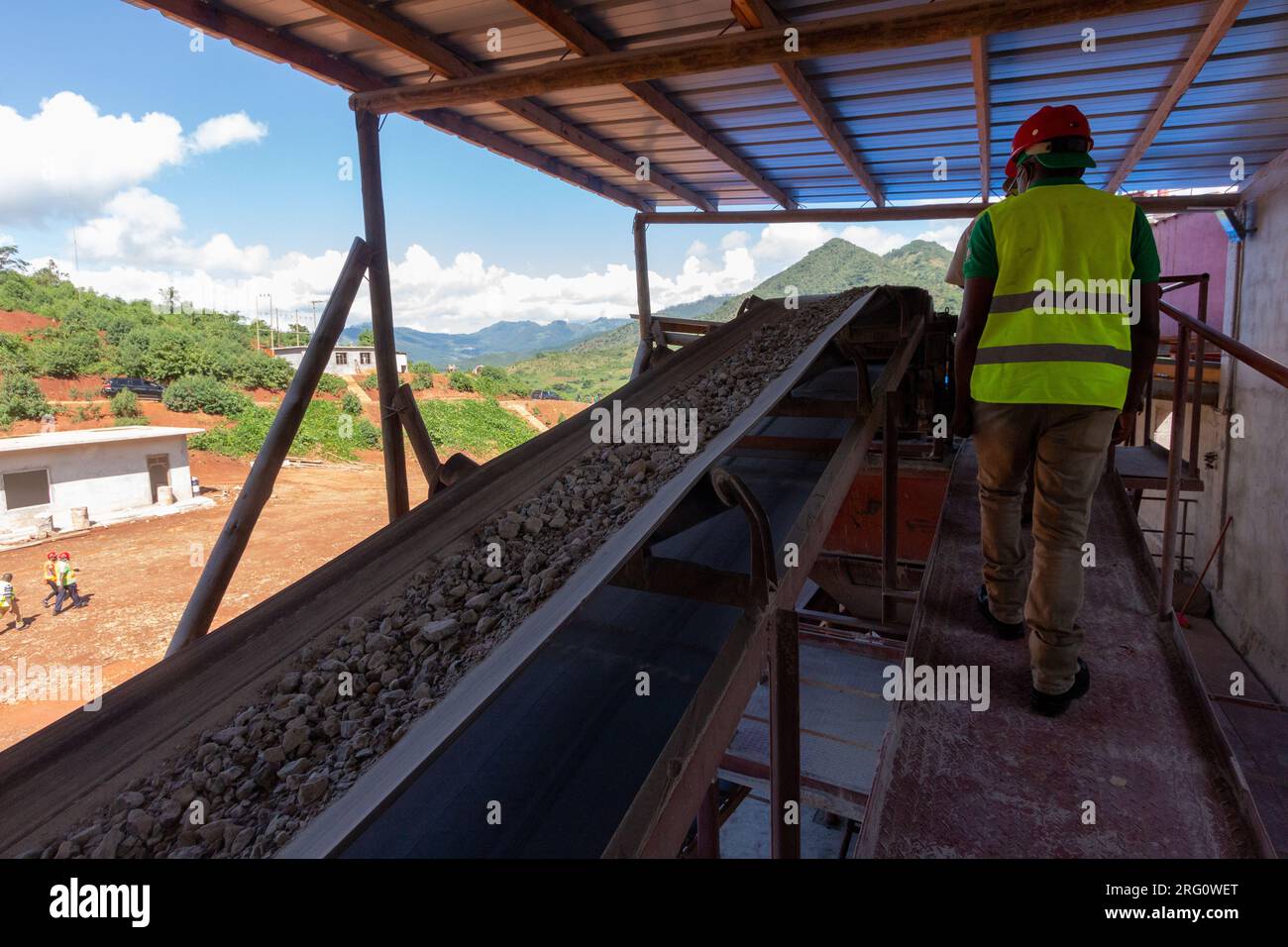 Crushed ore being sorted in a mat during industrial gold extraction Stock Photo