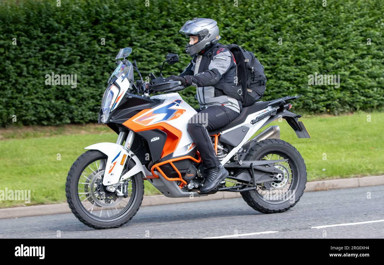 Whittlebury,Northants.,UK - Aug 6th 2023. 2023 orange KTM 1290 Super Adventure R 23 motorcycle travelling through an English village. Stock Photo