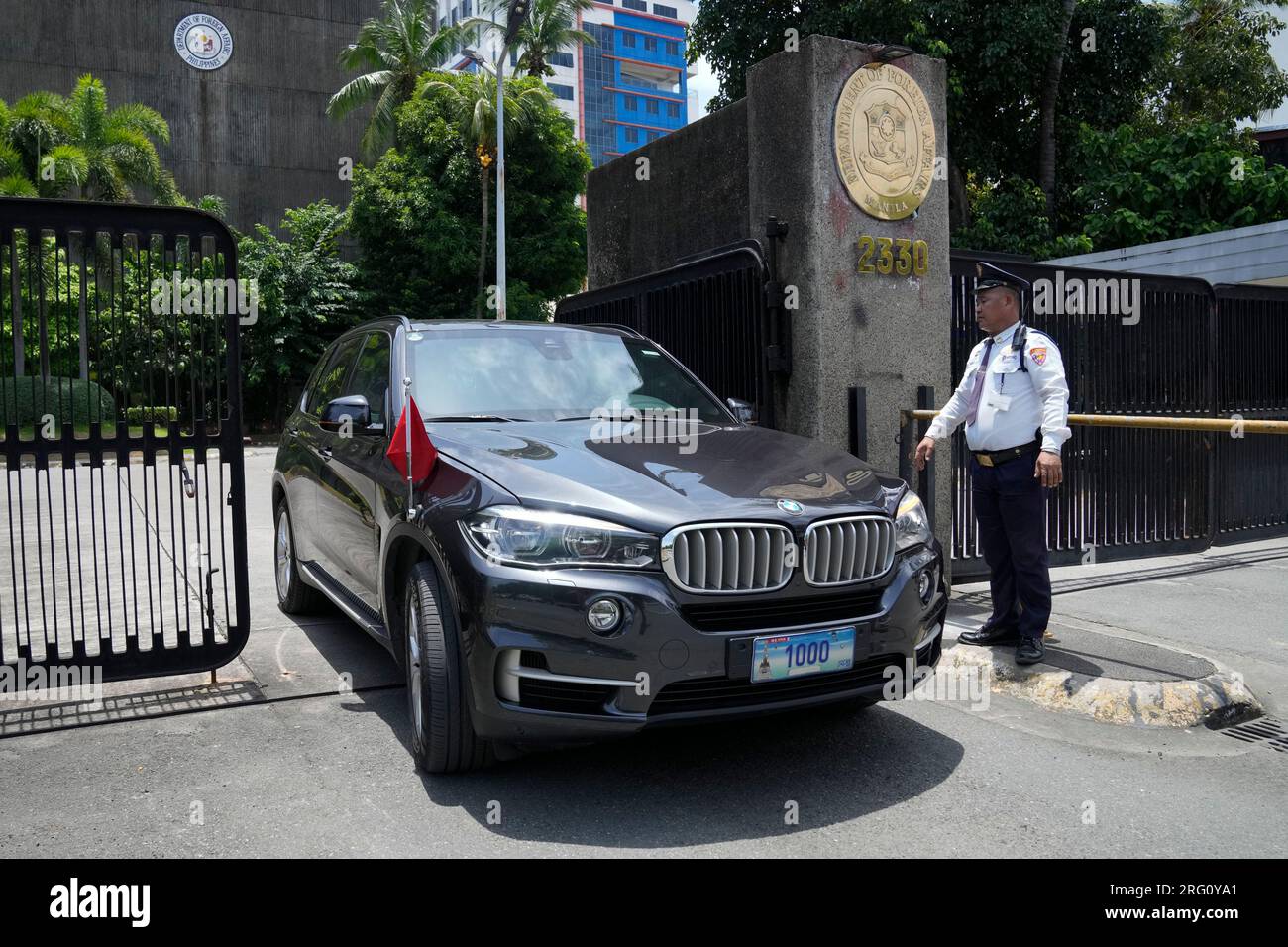 A Car With Diplomatic Plates And Chinese Flag Leaves The Philippine a-car-with-diplomatic-plates-and-chinese-flag-leaves-the-philippine