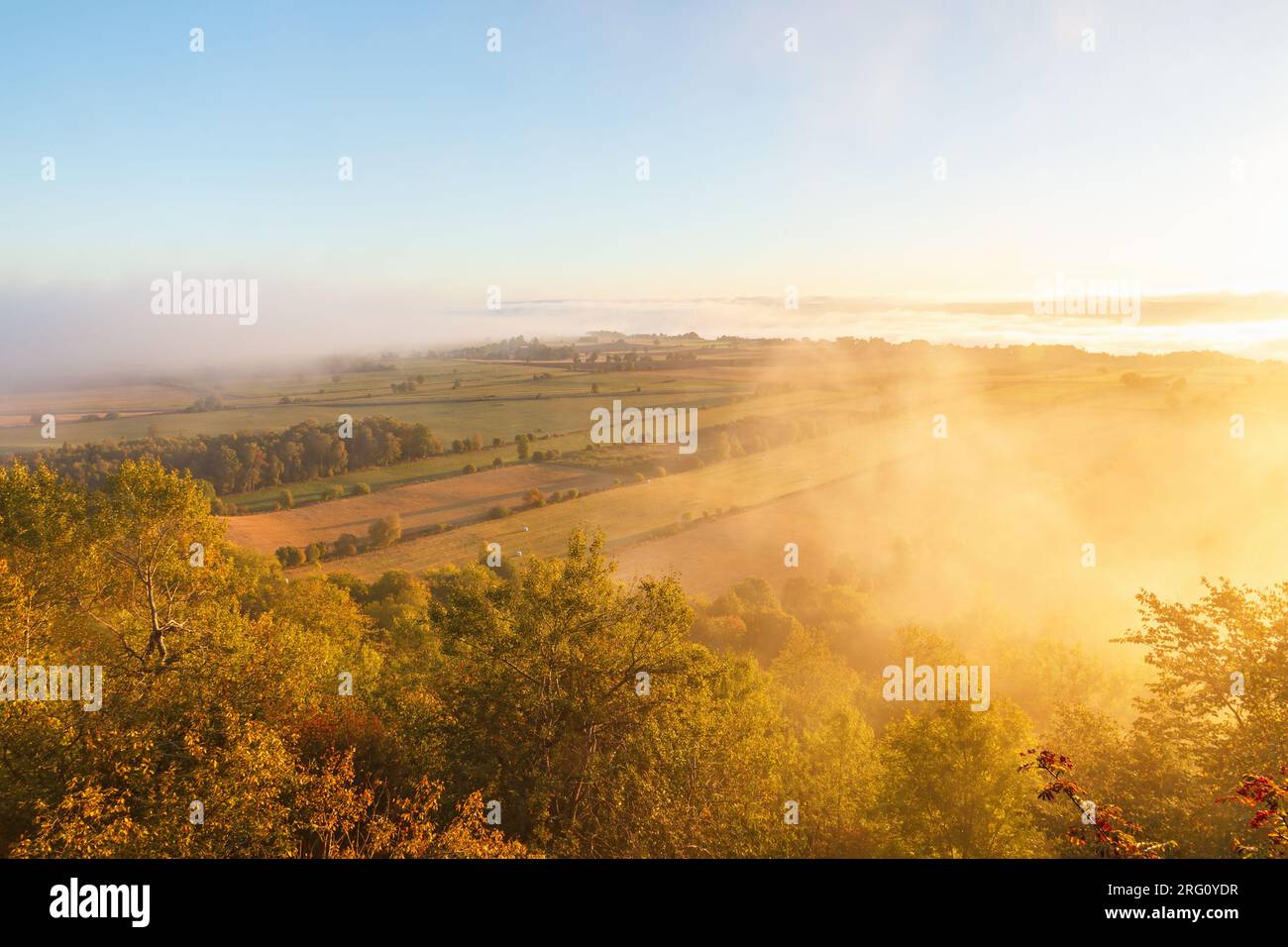 Sunrise with fog over a rural landscape view Stock Photo - Alamy