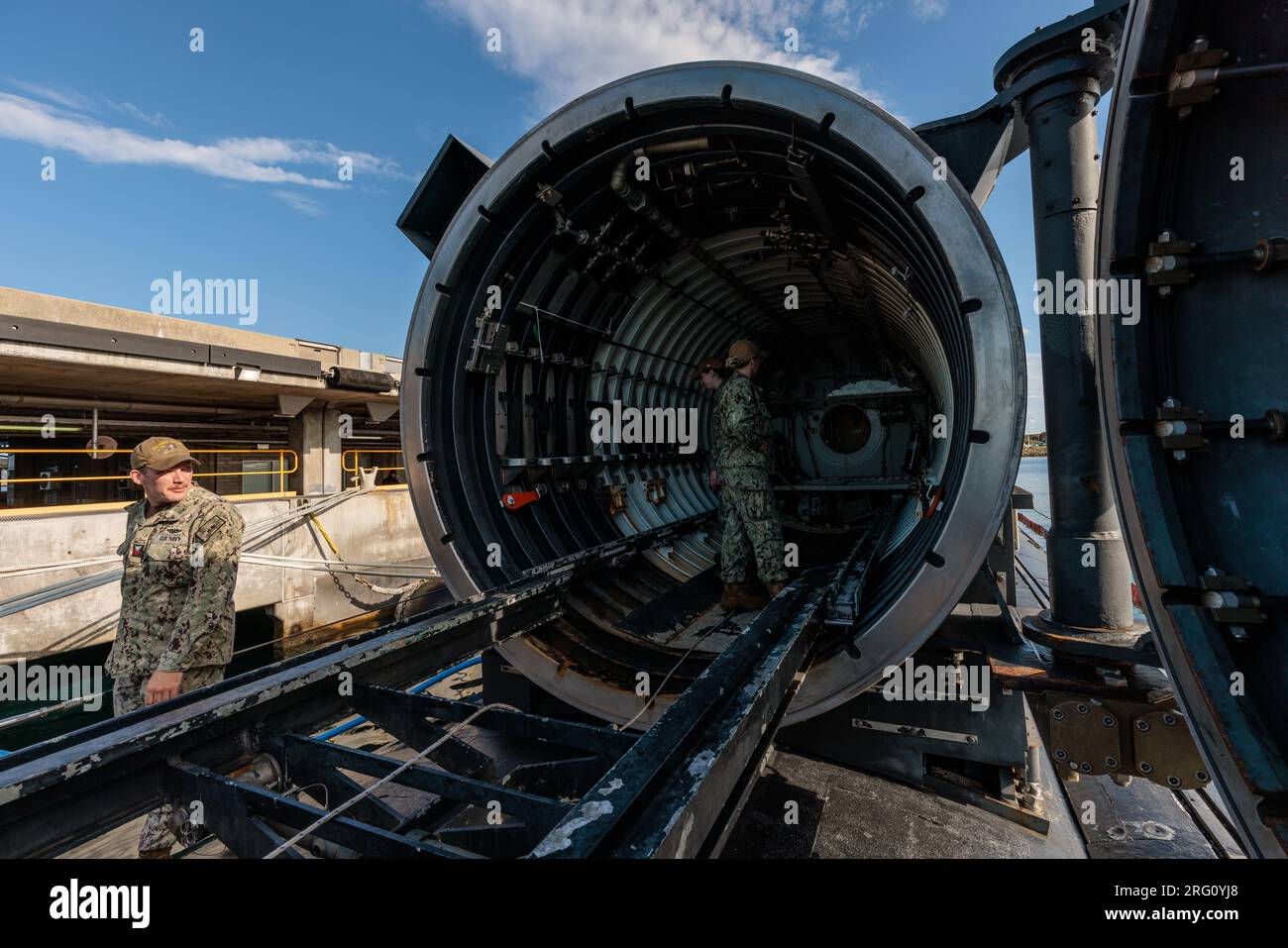 Crew members are seen in the dry dock shelter onboard the USS North ...