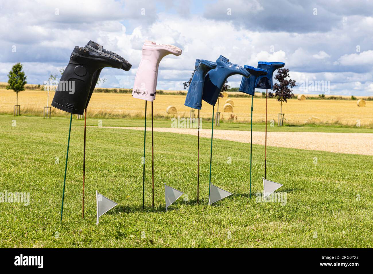 Wellie Wanging - Row of wellies ready for throwing competition. Stock Photo