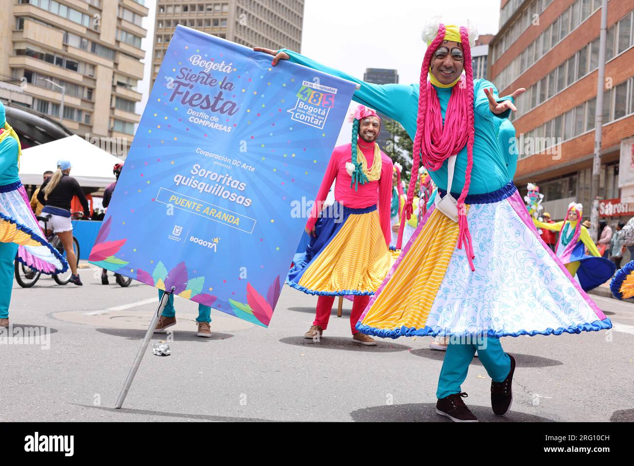 Bogota, Colombia. 6th Aug, 2023. An artist interacts with people in the