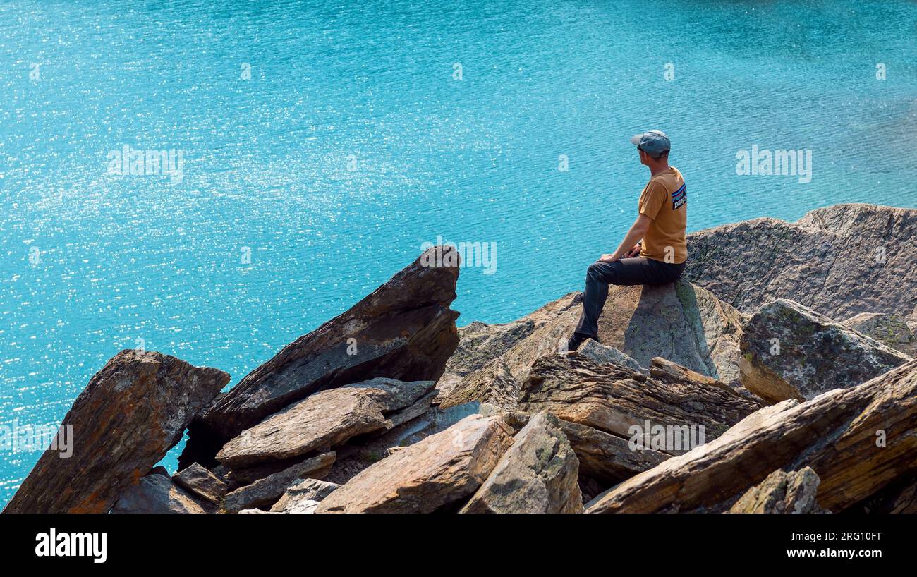 Male tourist and backpacker at Moraine lake, Banff national park, Canada. Stock Photo