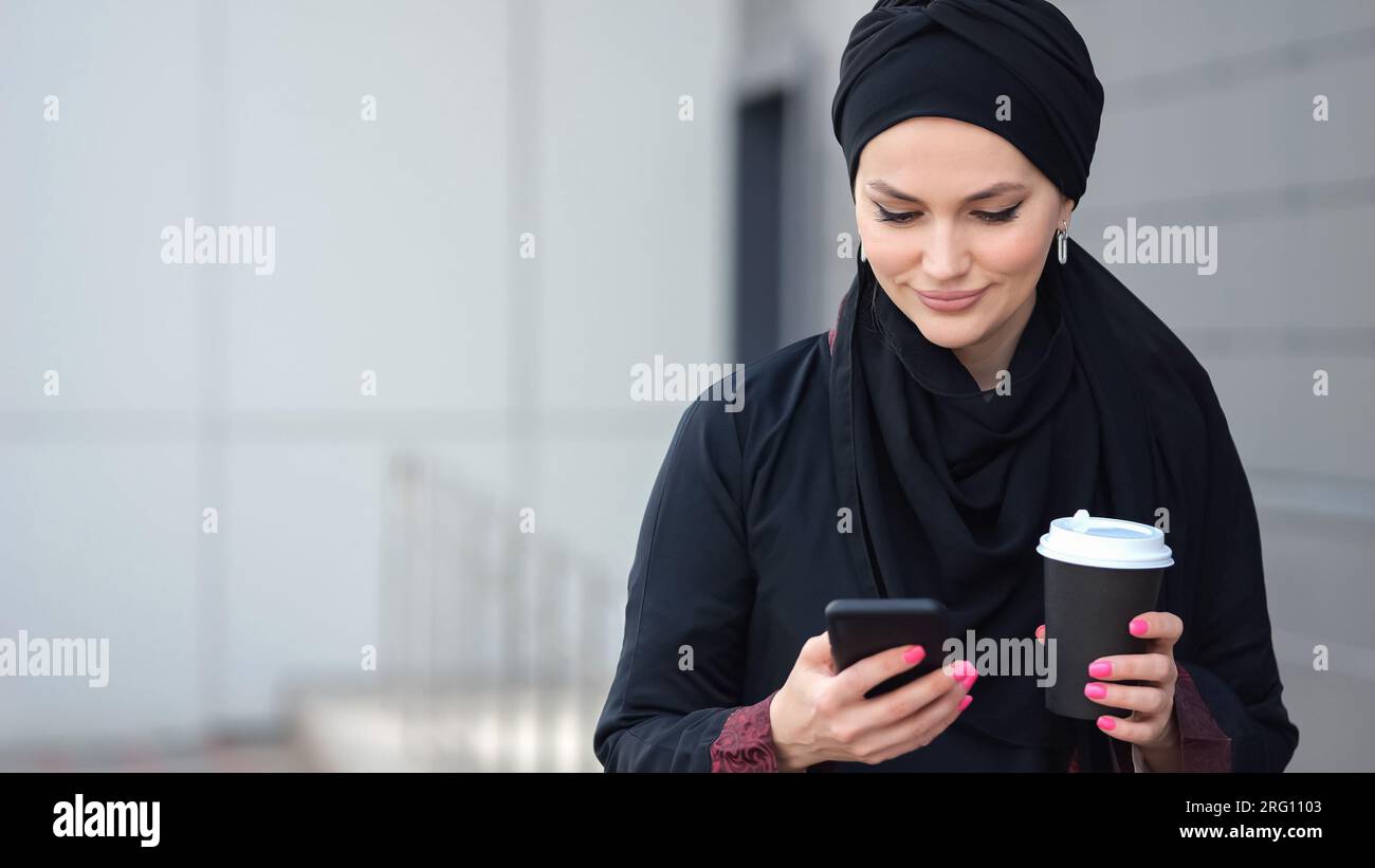 Girl in hijab scrolling hi-res stock photography and images - Alamy