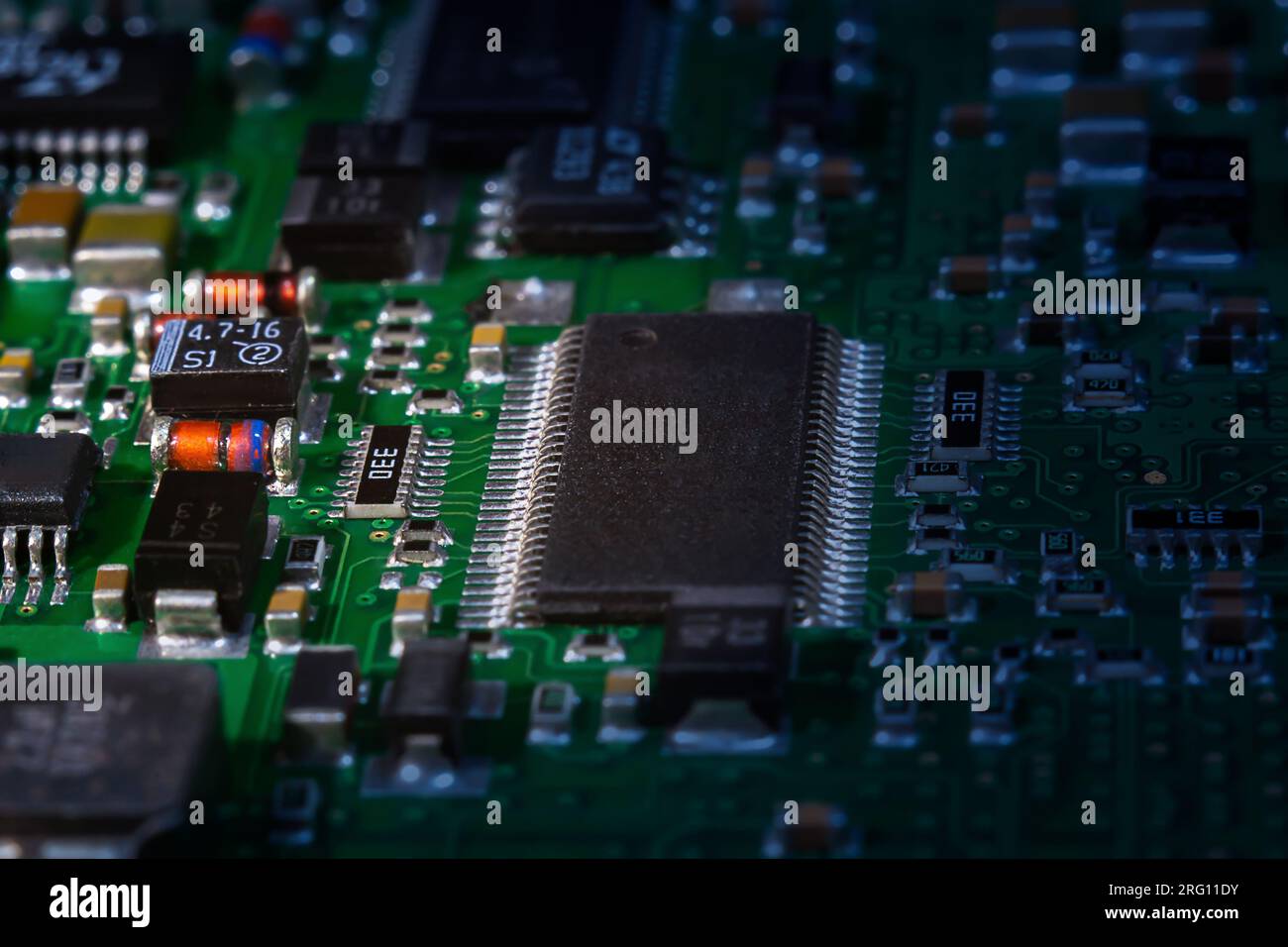 Intricate circuit board with computer hardware, showcasing complexity of electronics industry. Stock Photo