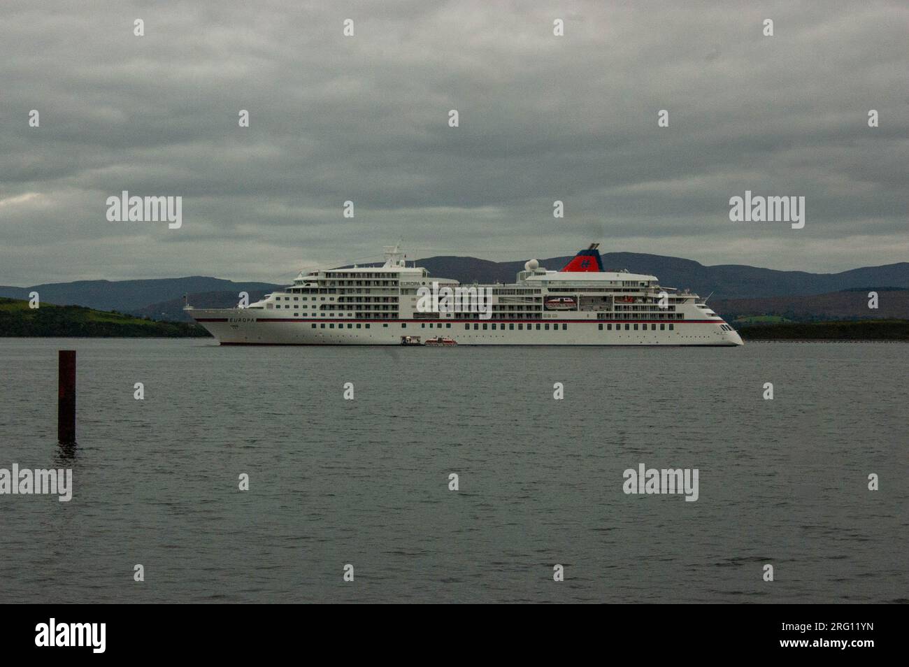 Monday Aug 7, 2023, Bantry West Cork Ireland; The cruise ship Europa arrived into Bantry port today. The Europa, a Malta Islands registered vessel, carrying 400 passengers set Her anchor at 8am and passengers disembarked for day trips to Killarney, the Beara peninsula and around Bantry town. Credit; ED/Alamy Live News Stock Photo