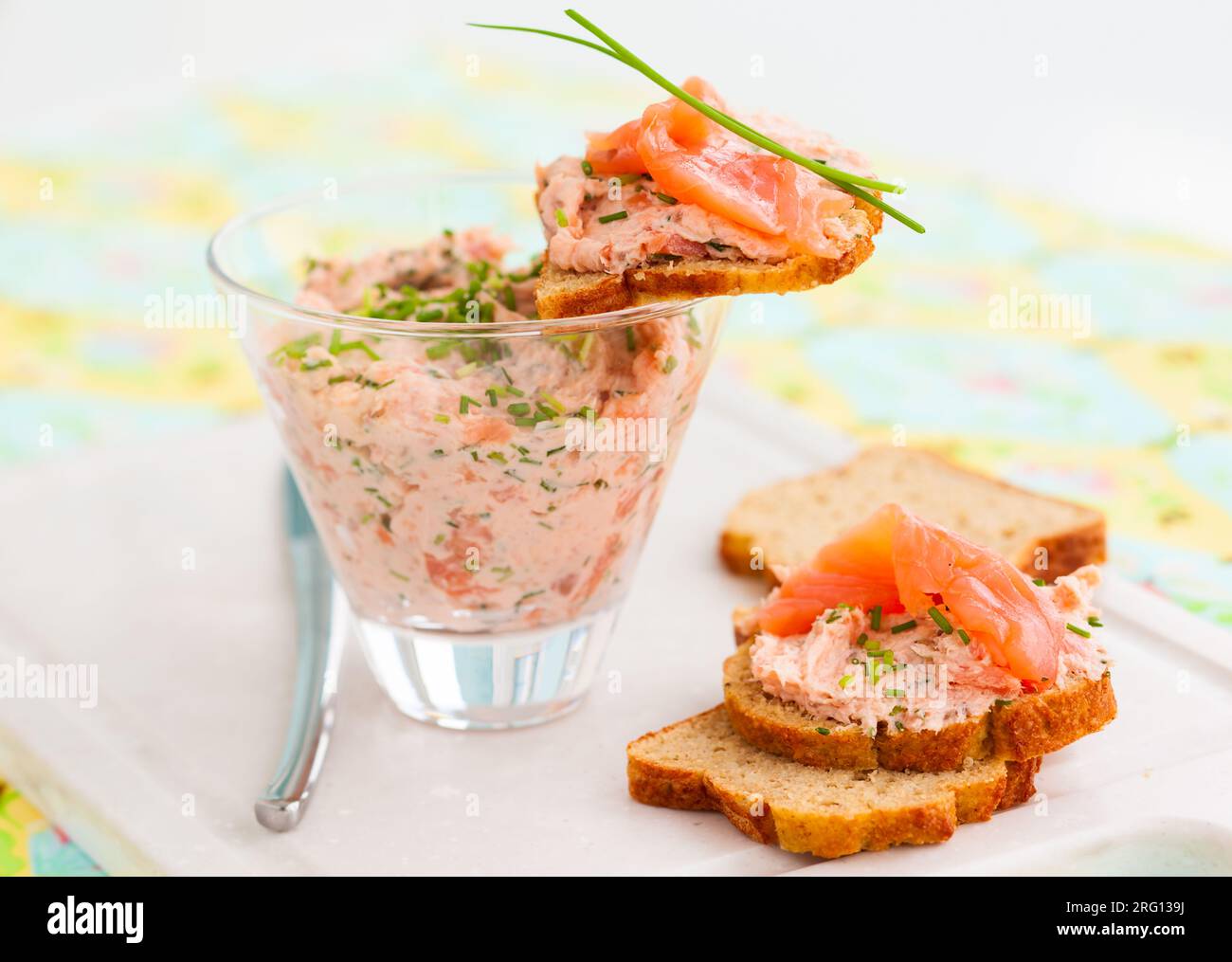 Salmon and soft cheese spread on bread Stock Photo