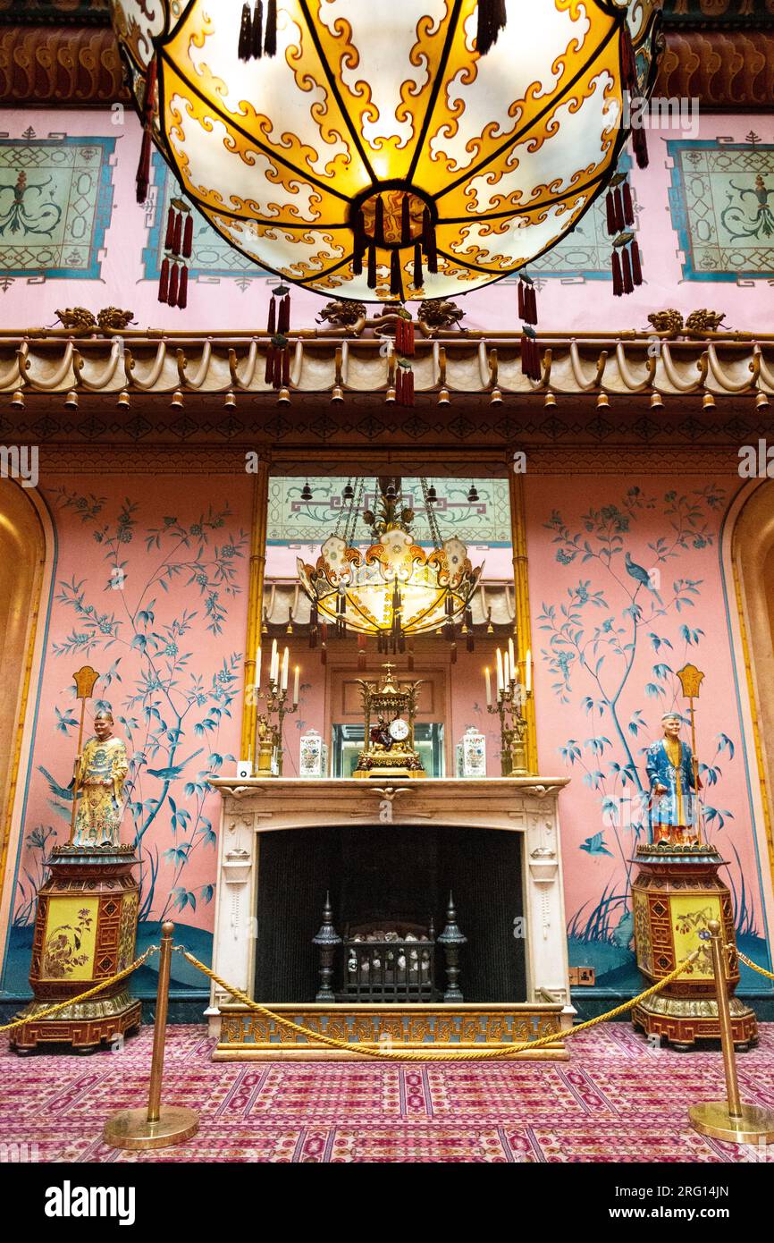 Fireplace and chandelier in the Long Gallery, Royal Pavilion (Brighton Pavilion), Brighton, England Stock Photo
