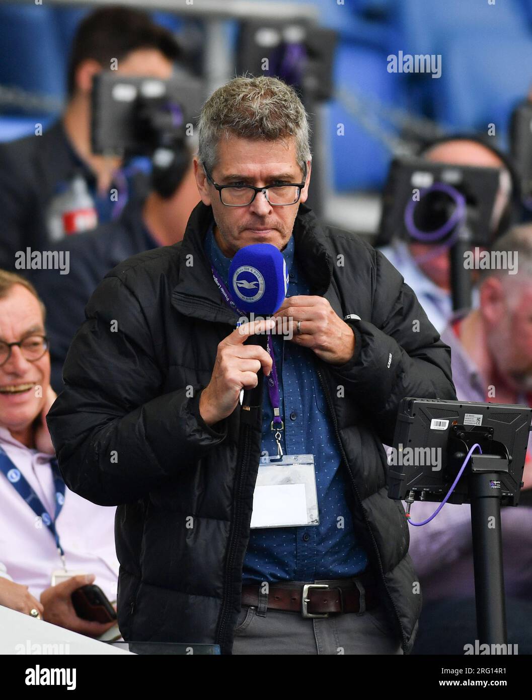 Broadcaster and stadium announcer Dave Beckett at the Pre Season Friendly match match between Brighton and Hove Albion and Rayo Vallecano at the Amex Stadium , Brighton , UK - 06 August 2023 -  Credit Simon Dack/ Telephoto Images Stock Photo