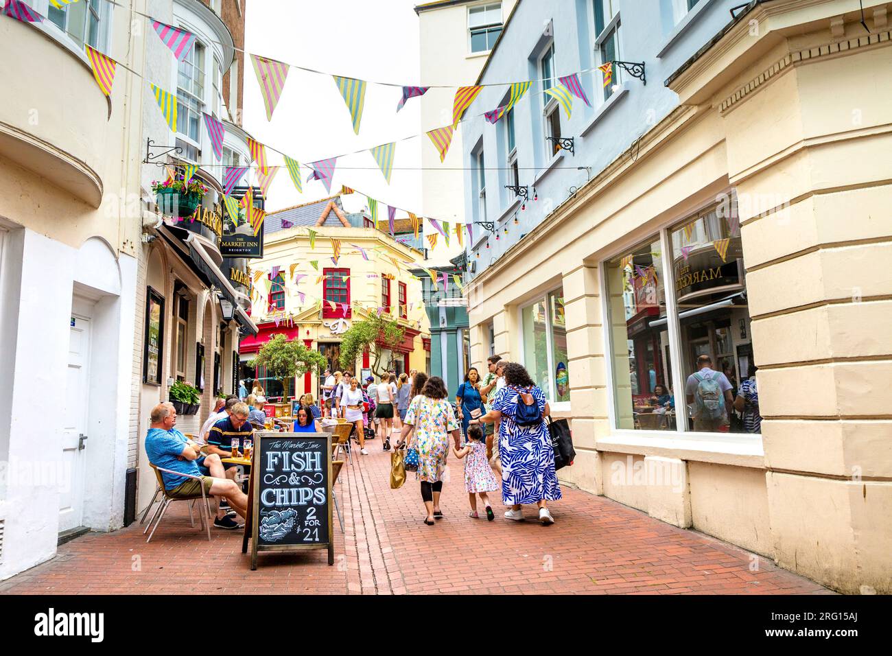 The Market Inn pub and people walking into The Lanes shopping district, Brighton, England Stock Photo