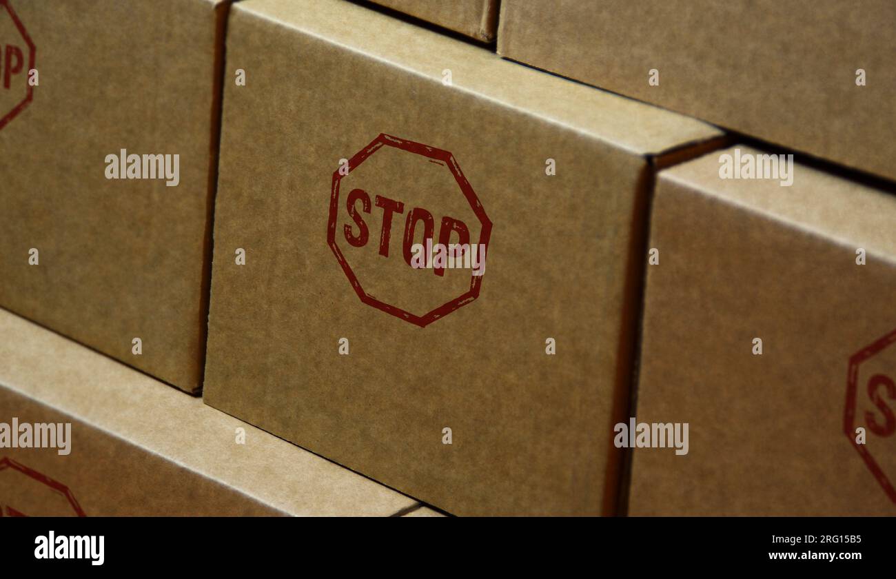 Stop stamp printed on cardboard box. Blocked and ban concept. Stock Photo