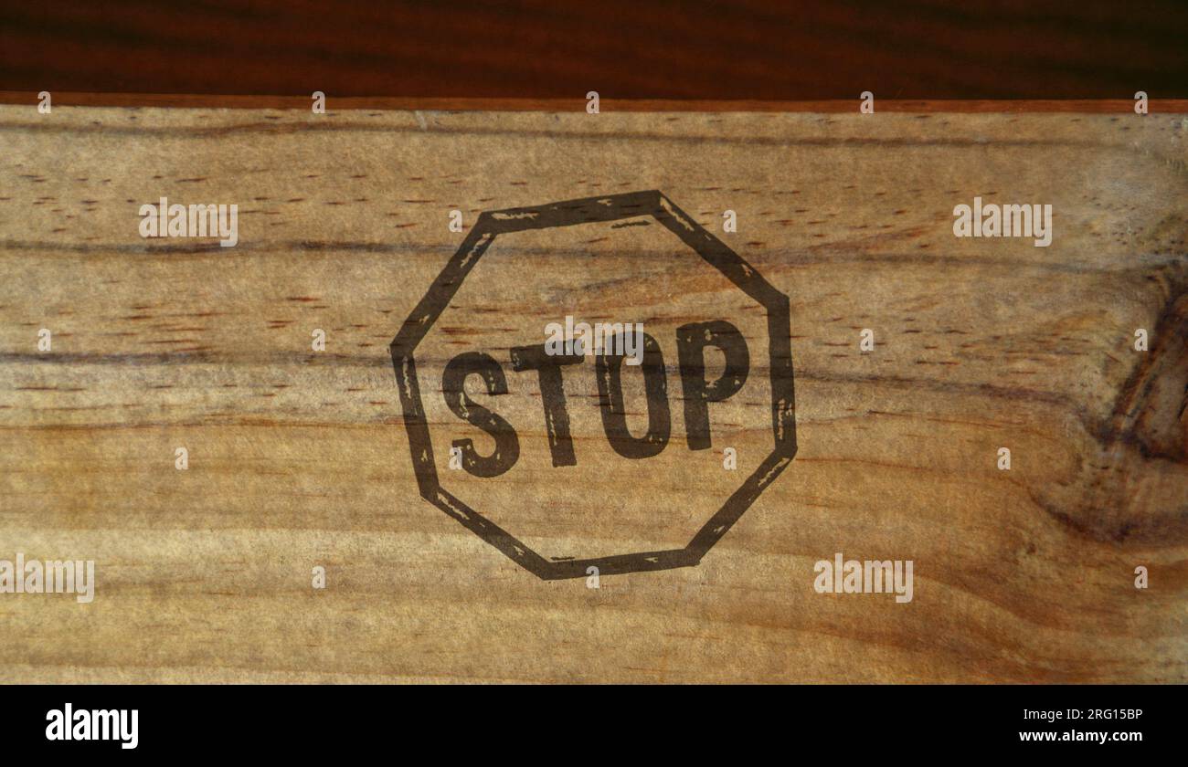 Stop stamp printed on wooden box. Blocked and ban concept. Stock Photo