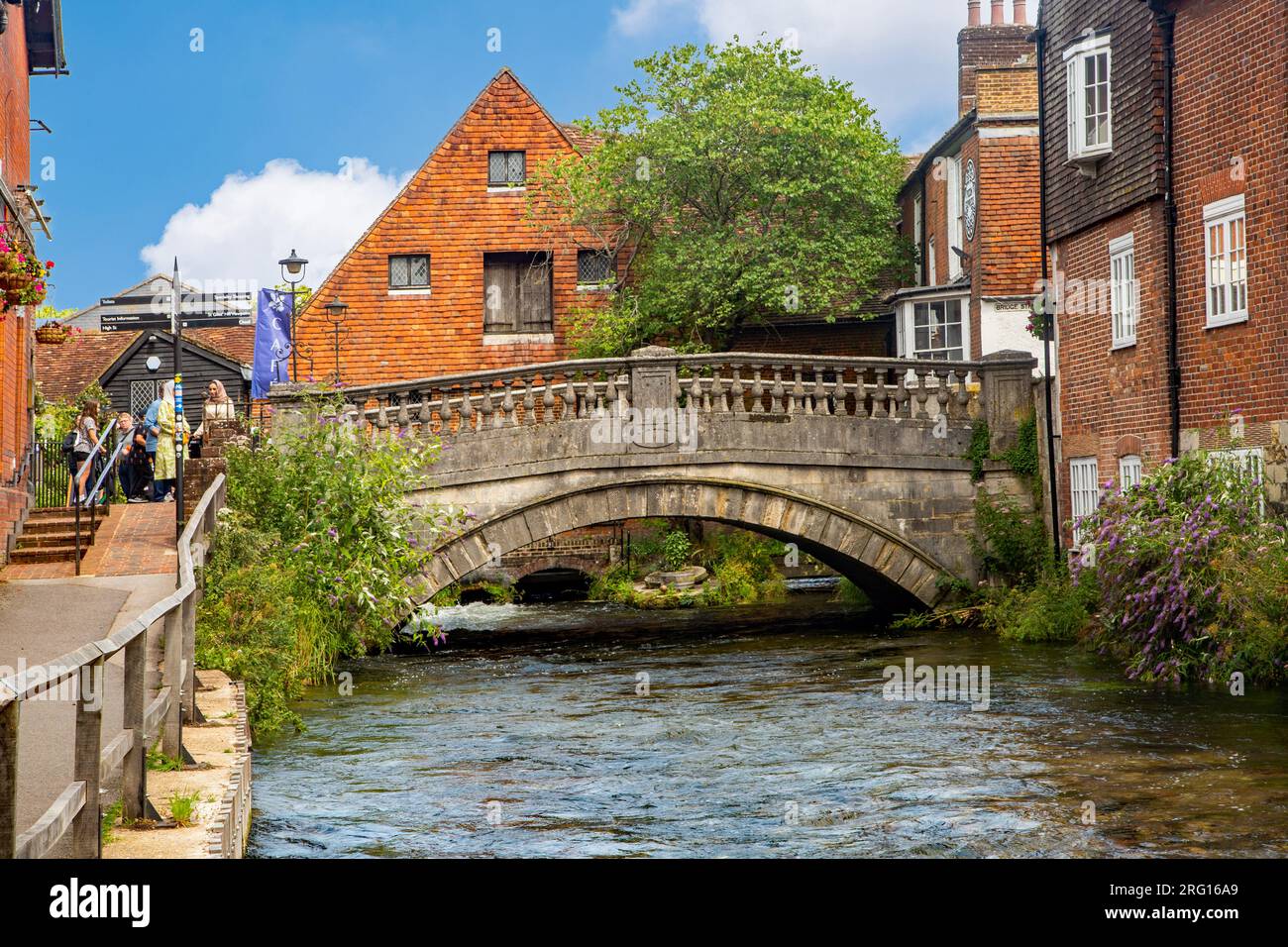 View of the river Itchen flowing under the water mill in the Hampshire city of Winchester England UK Stock Photo