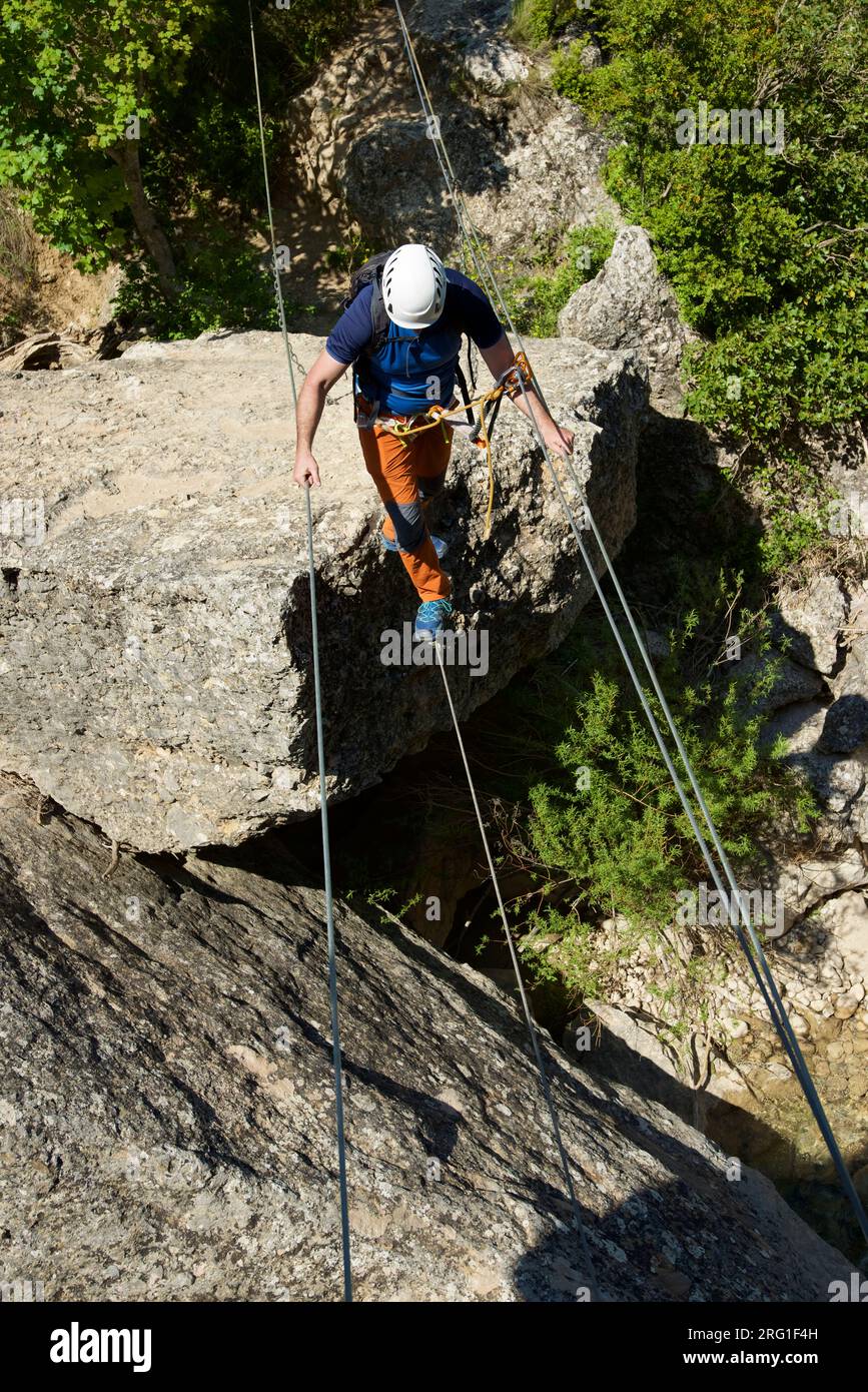 Person crossing stone bridge hi-res stock photography and images - Alamy