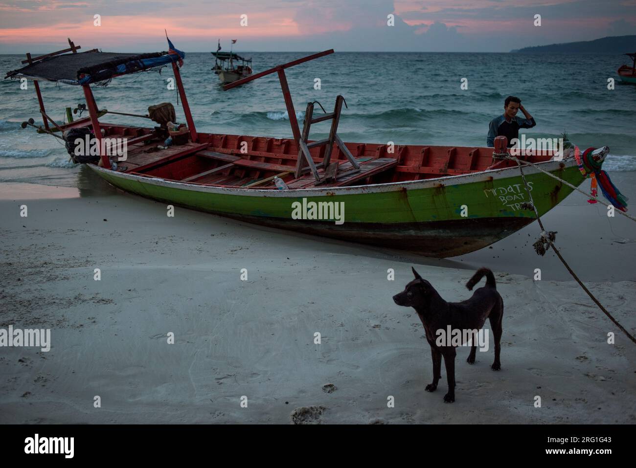 Koh Rong Fish Both A fishing boat moored at a white sand beach in Koh Rong Island ...