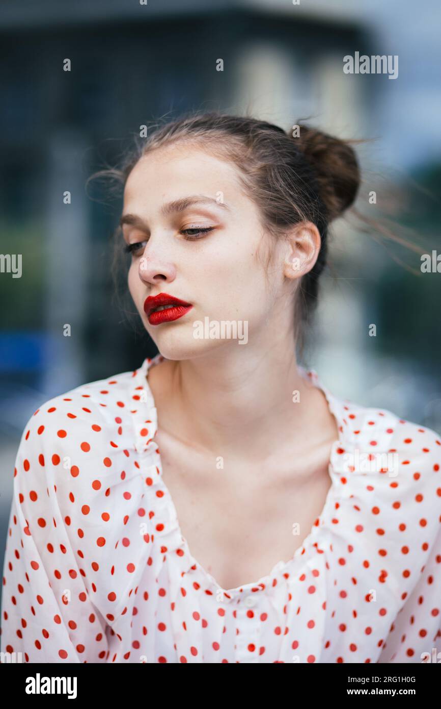 Close-up portrait of young woman wearing red lipstick Stock Photo