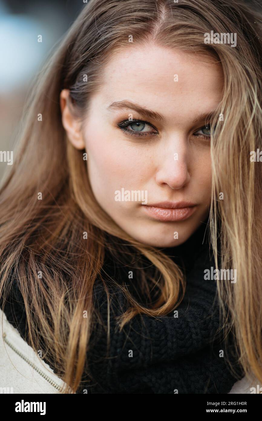 Close-up portrait of young blue-eyed woman Stock Photo