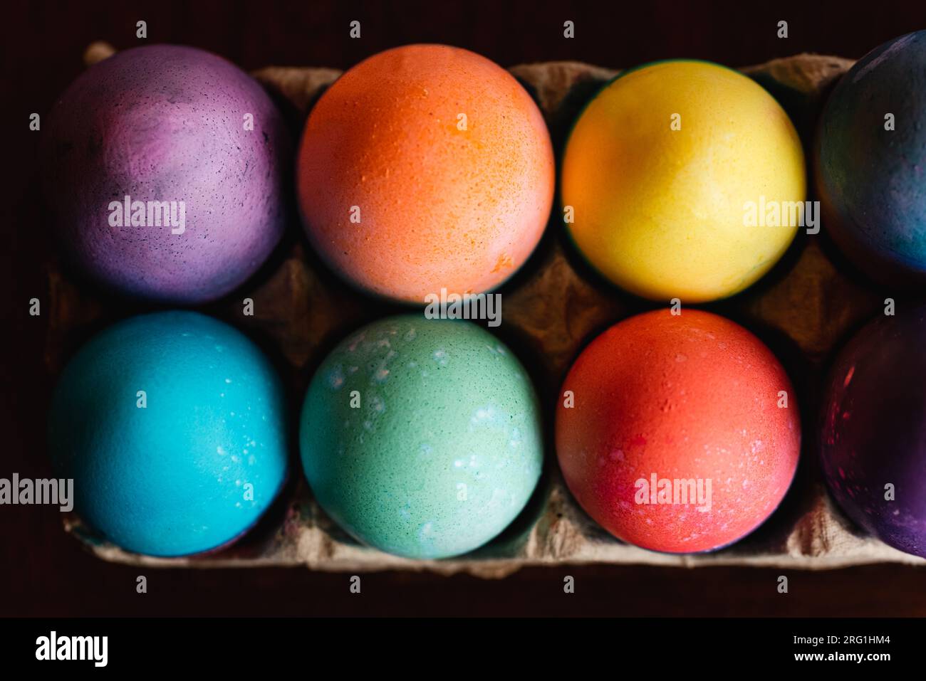 High angle close up of brightly colored Easter eggs. Stock Photo