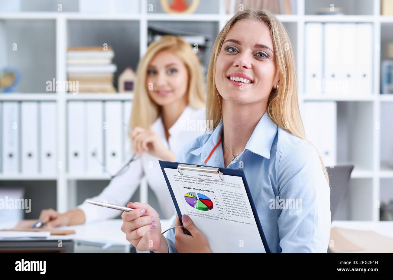 Two beautiful business woman portrait Stock Photo - Alamy