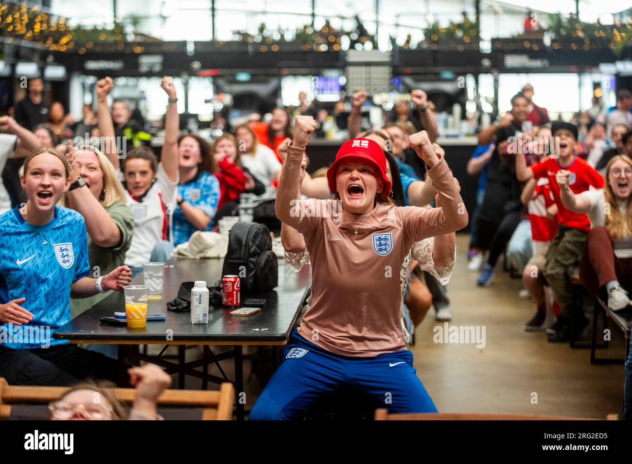 london-uk-7-august-2023-fans-at-boxpark-in-wembley-park-react-during