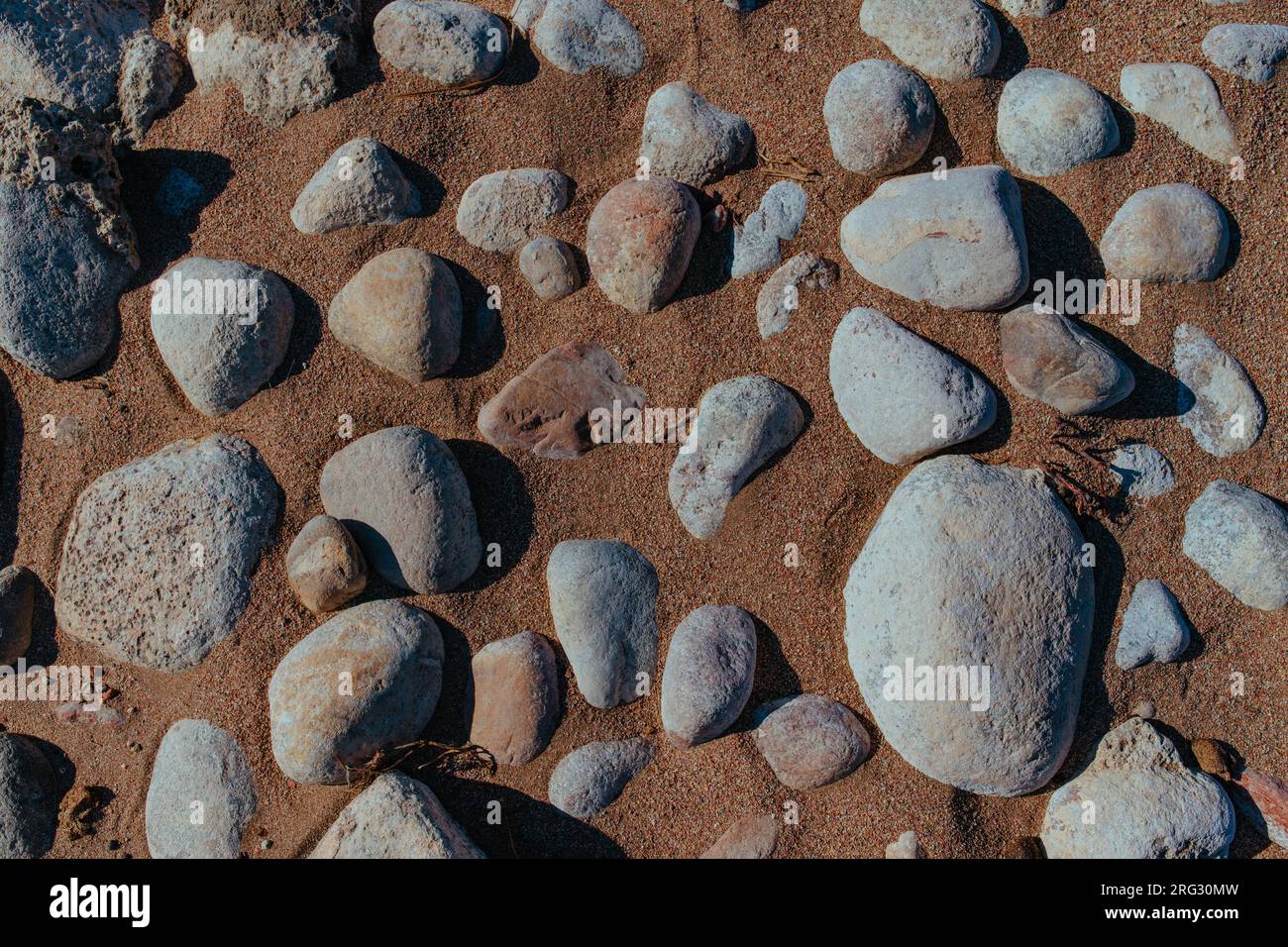 Stones on dried riverbed Stock Photo