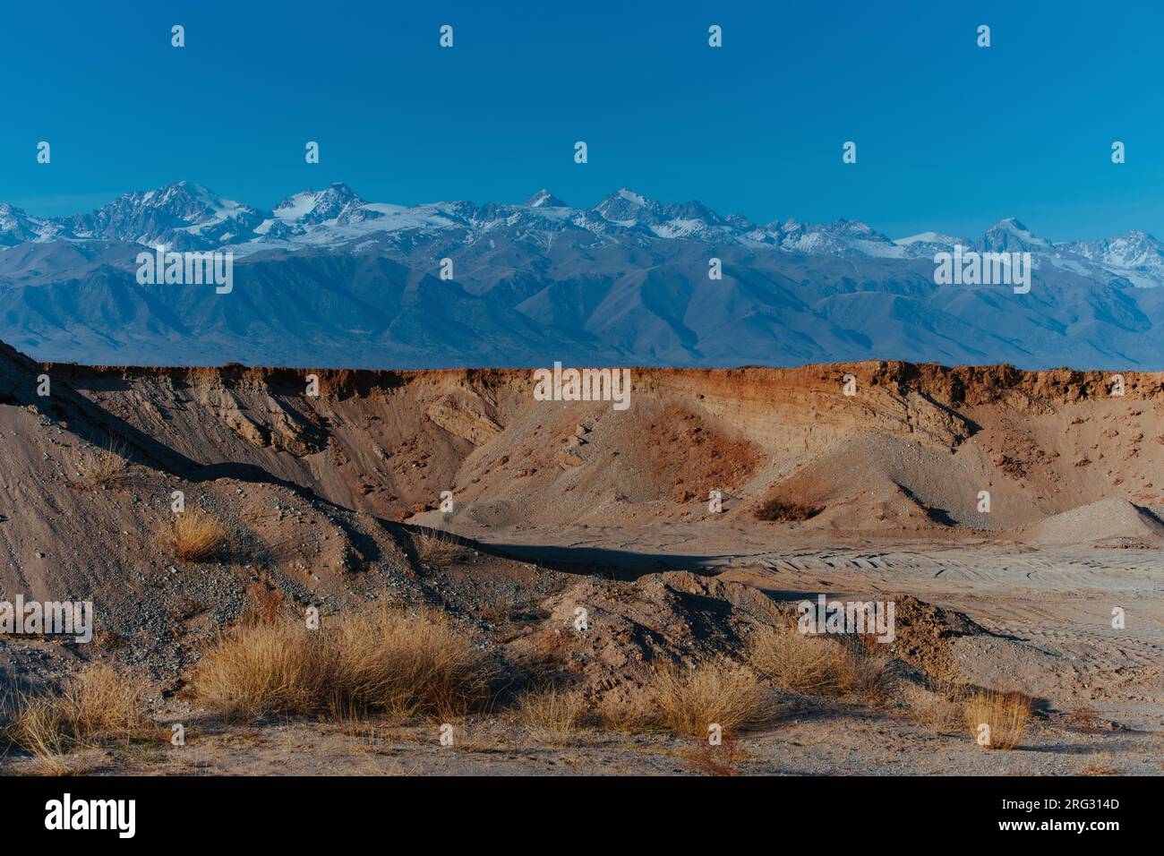 Sand and gravel quarry on mountains background, Kyrgyzstan Stock Photo