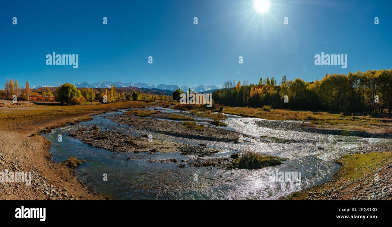 Autumn panorama with mountain river in Kyrgyzstan at sunny day Stock Photo