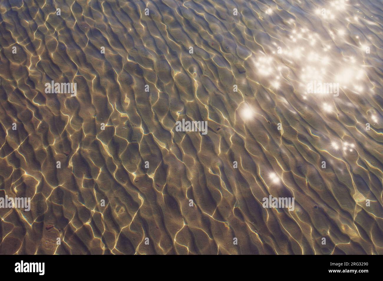 Surface of sea water with sun glare Stock Photo