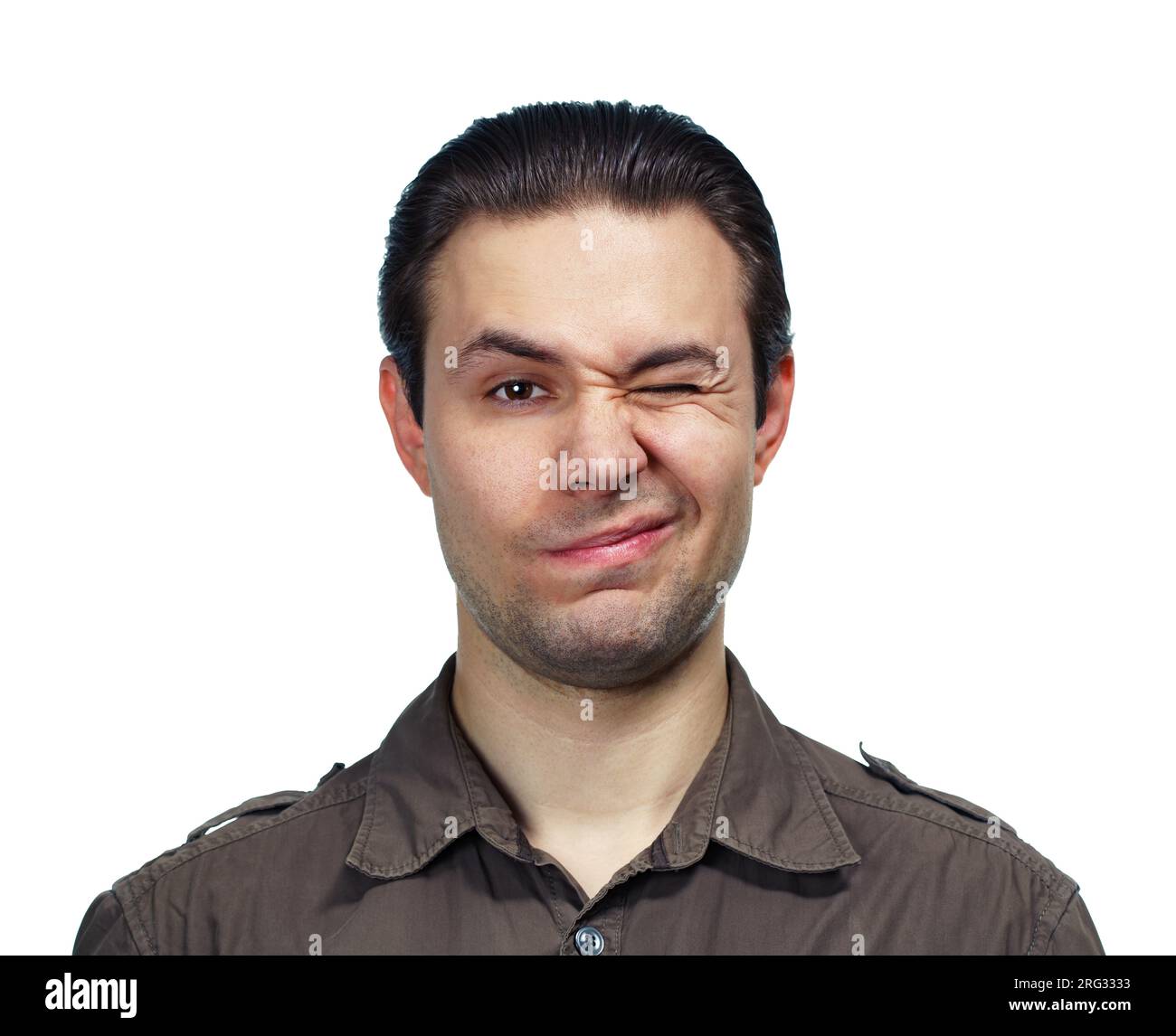 Young handsome man blinking portrait on white background Stock Photo