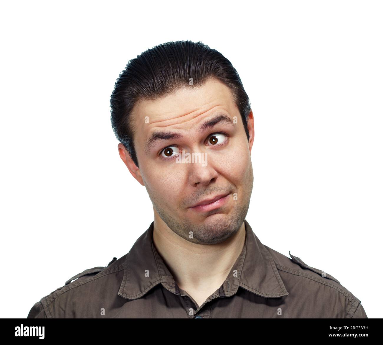 Young surprised man looking aside, emotional portrait on white background Stock Photo