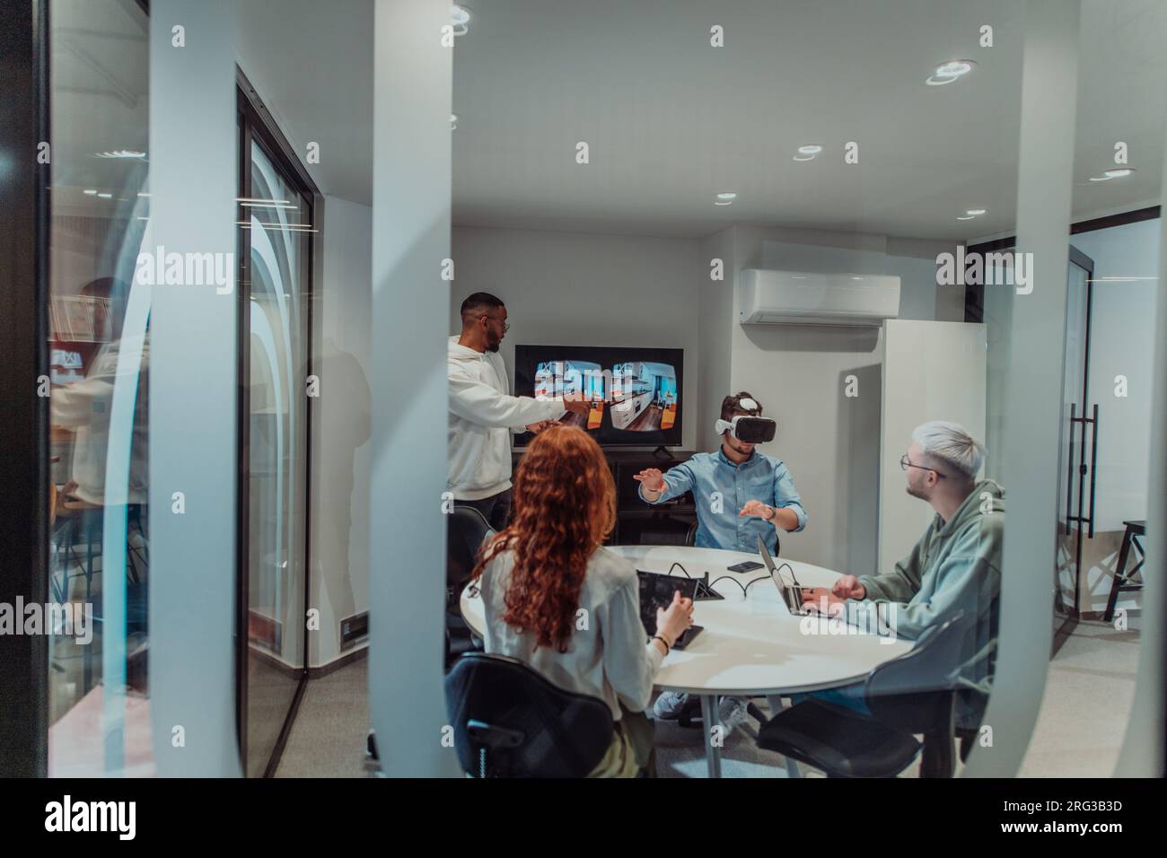 A diverse group of businessmen collaborates and tests a new virtual ...