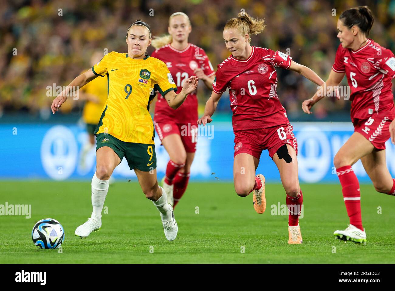 Sydney, Australia. 07th Aug, 2023. Caitlin Foord of Australia attacks with Karen Holmgaard of Denmark in pursuit during the round of 16 FIFA Women's World Cup 2023 match between Australia Women and Denmark Women at Stadium Australia, Sydney, Australia on 7 August 2023. Photo by Peter Dovgan. Editorial use only, license required for commercial use. No use in betting, games or a single club/league/player publications. Credit: UK Sports Pics Ltd/Alamy Live News Stock Photo