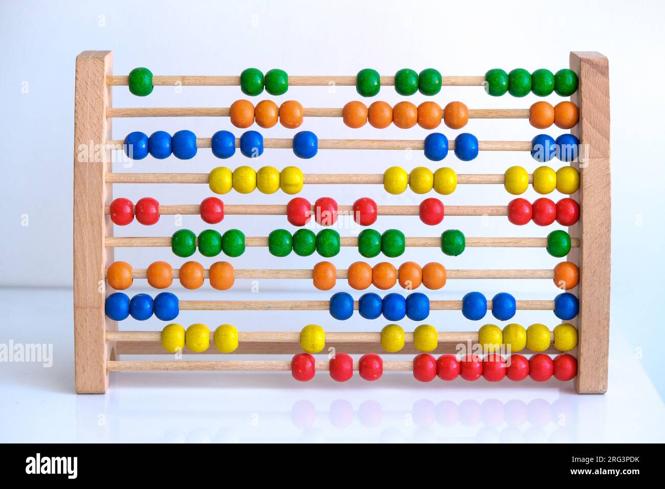 Close up colorful school abacus bead background for kids. Education school mathematics background. Kids learning count, children math class concept. Stock Photo