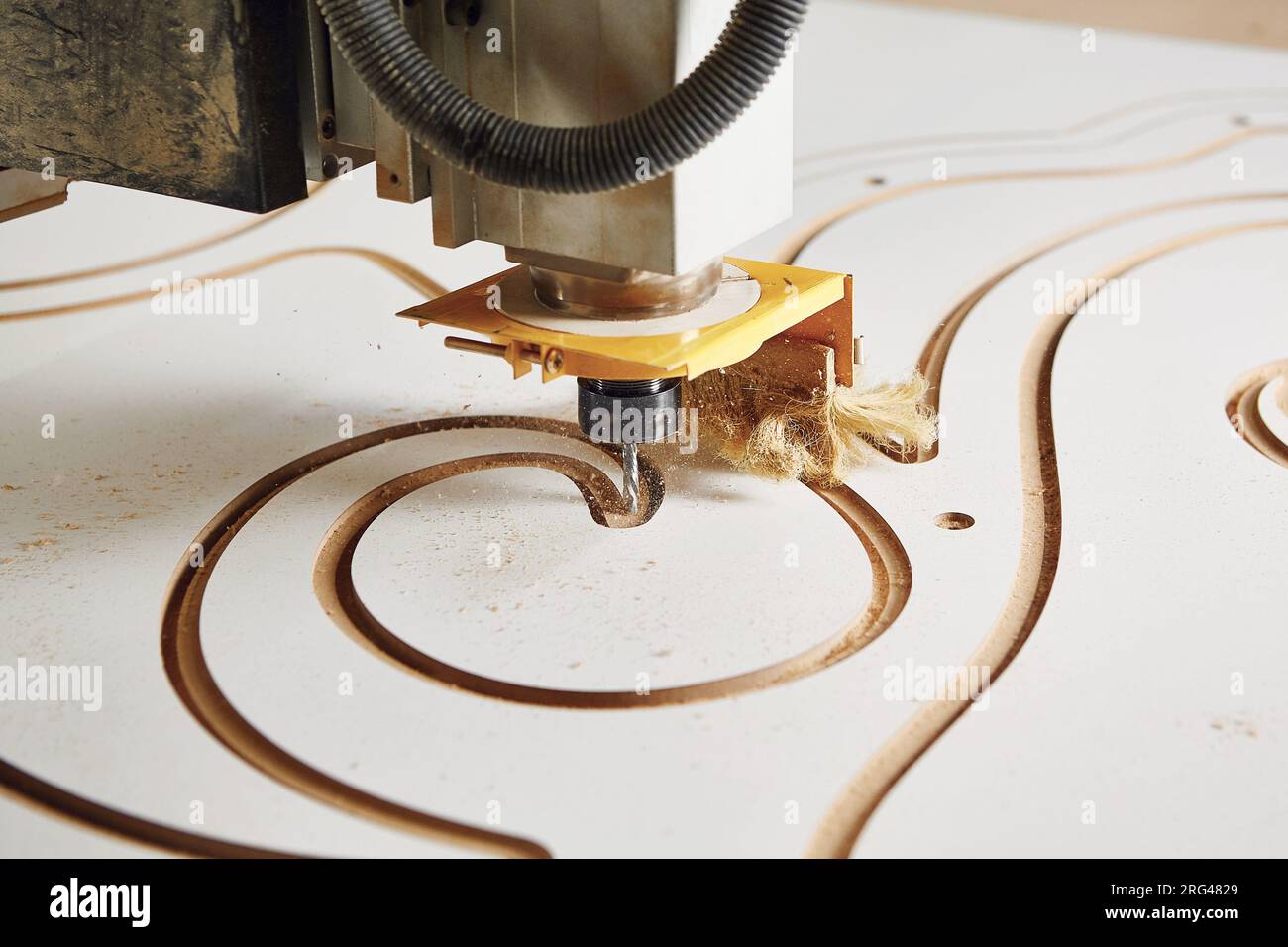 Cnc machine at carpentry workshop. Cutting wood with various router ...