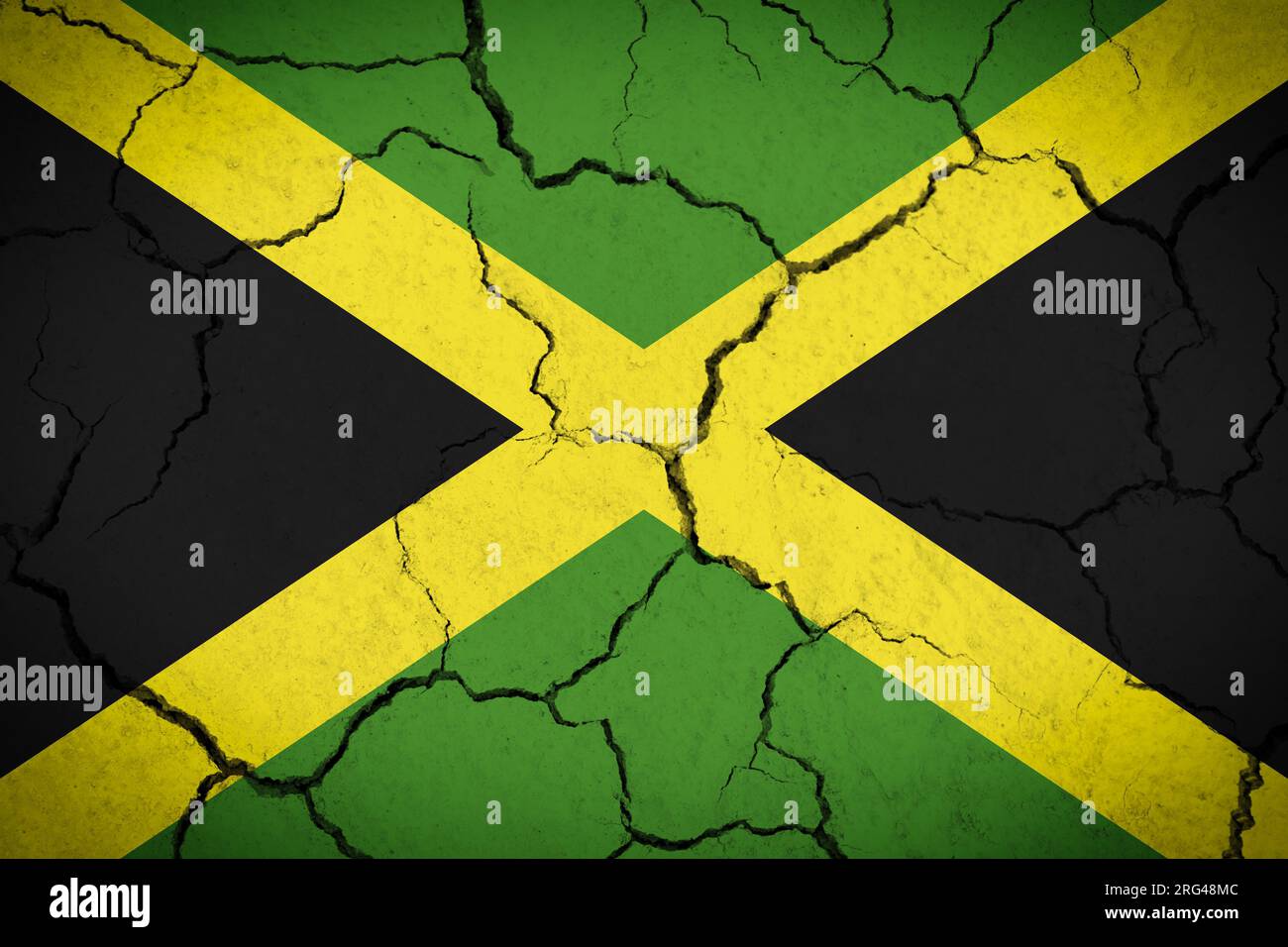 A cracked Jamaica flag on a concrete background