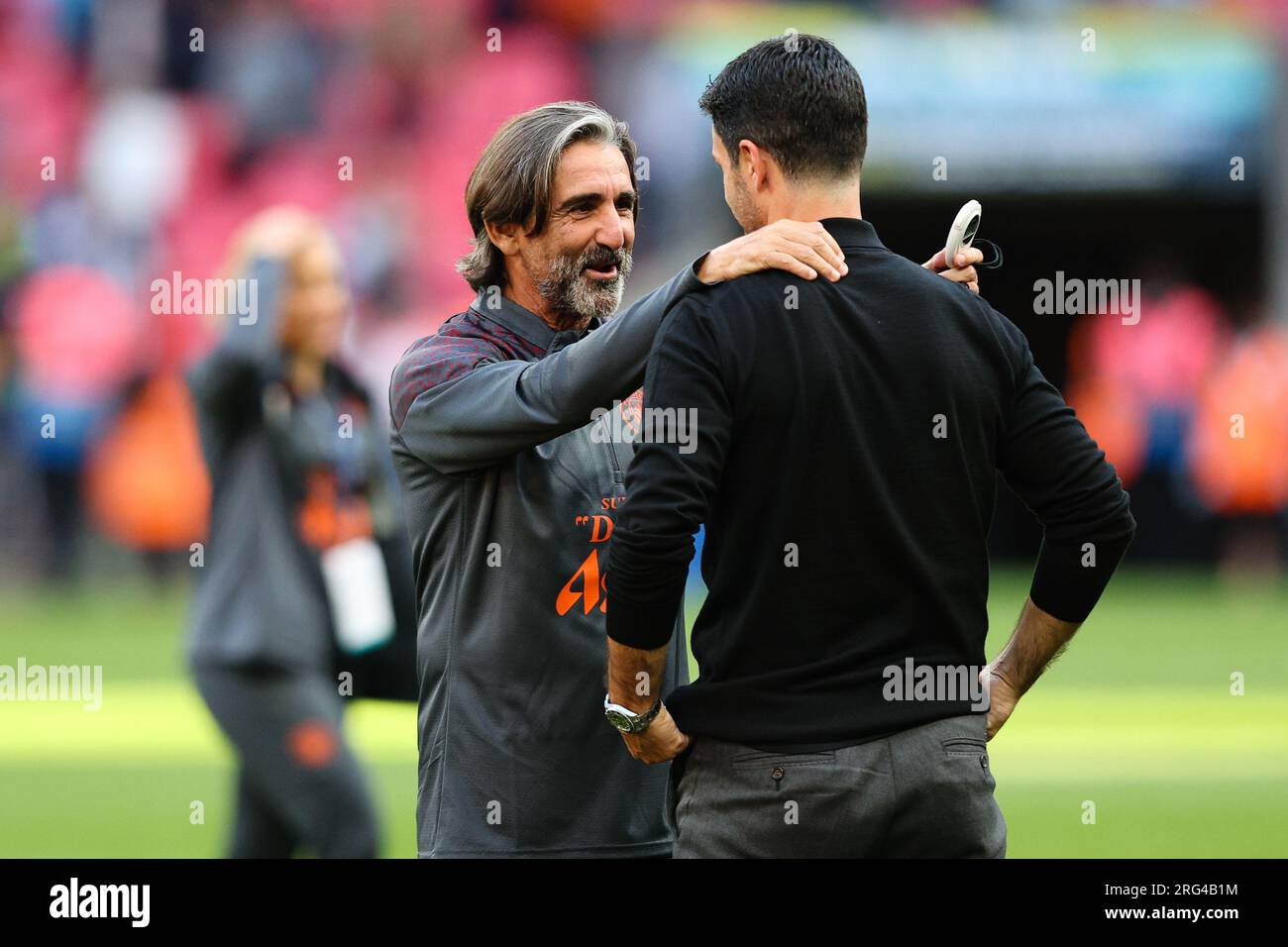 LONDON, UK - 6th Aug 2023:  Manchester City Fitness Coach Lorenzo Buenaventura talks to Arsenal manager Mikel Arteta after The FA Community Shield mat Stock Photo