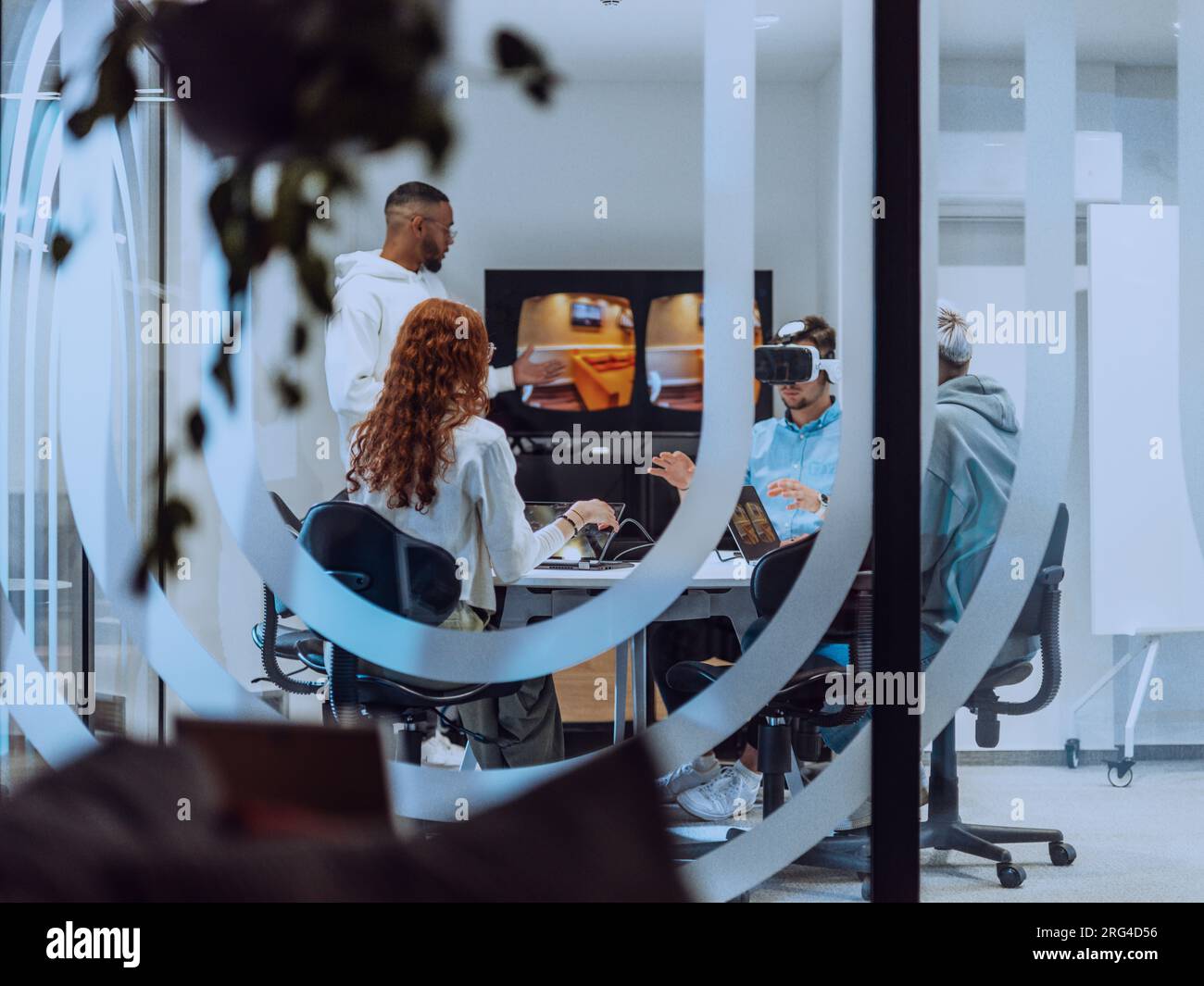 A diverse group of businessmen collaborates and tests a new virtual ...