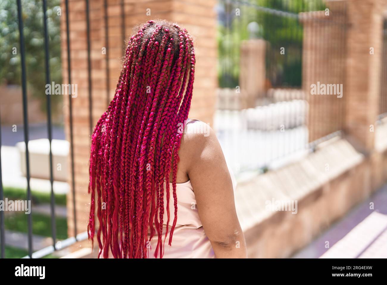 Back view woman braids walking hi-res stock photography and images - Alamy