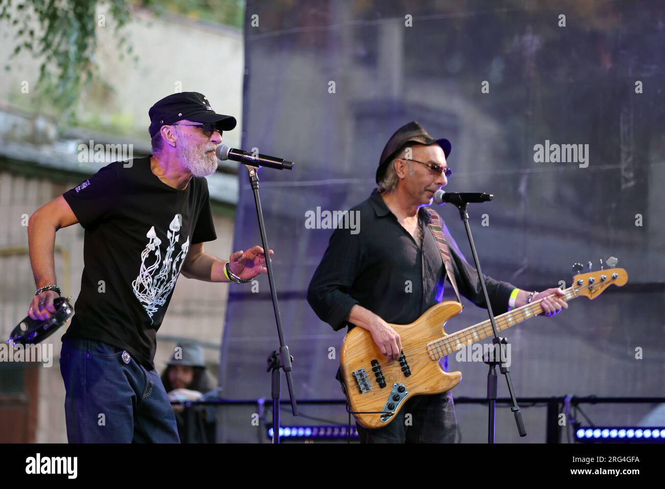 IVANO-FRANKIVSK, UKRAINE - AUGUST 5, 2023 - Mykhailo Lundin (L) and Ihor Melnychuk of the Braty Hadiukiny rock band perform during a charity concert i Stock Photo