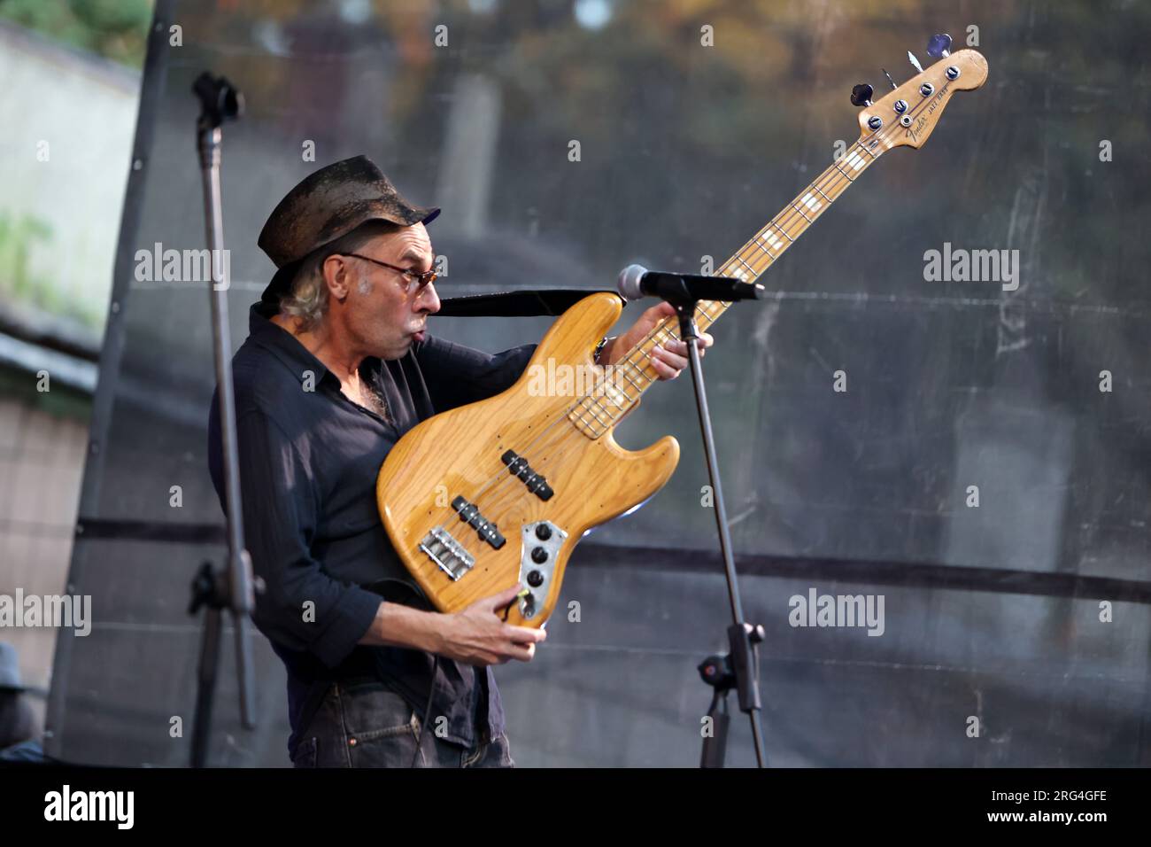 IVANO-FRANKIVSK, UKRAINE - AUGUST 5, 2023 - Ihor Melnychuk of the Braty Hadiukiny rock band plays the guitar during a charity concert in support of th Stock Photo