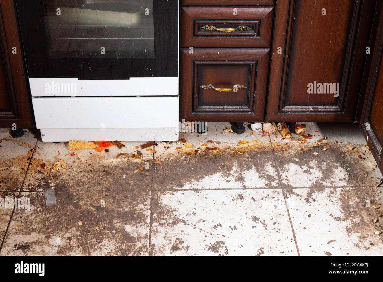 Dirty kitchen floor. Very dirty light tile floor in the kitchen