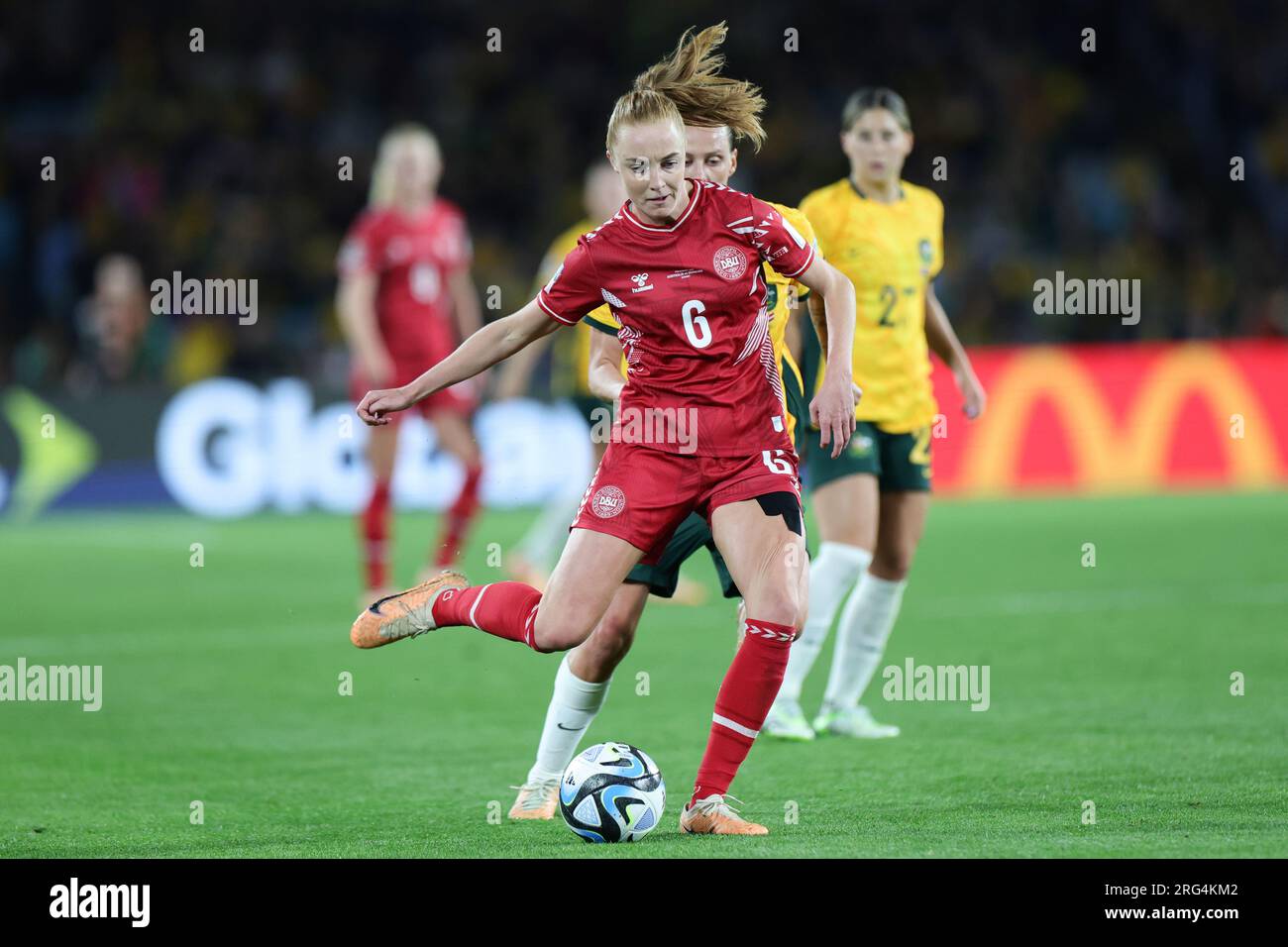 Sydney, Australia. 07th Aug, 2023. Karen Holmgaard of Denmark passes the ball during the round of 16 FIFA Women's World Cup 2023 match between Australia Women and Denmark Women at Stadium Australia, Sydney, Australia on 7 August 2023. Photo by Peter Dovgan. Editorial use only, license required for commercial use. No use in betting, games or a single club/league/player publications. Credit: UK Sports Pics Ltd/Alamy Live News Stock Photo