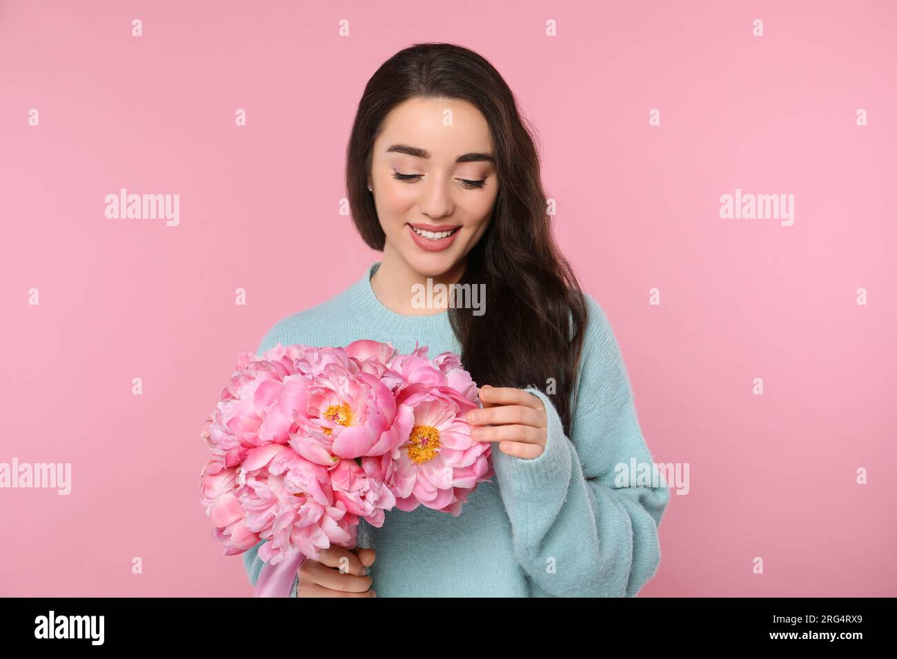 Woman with bouquet of peonies hi-res stock photography and images - Alamy